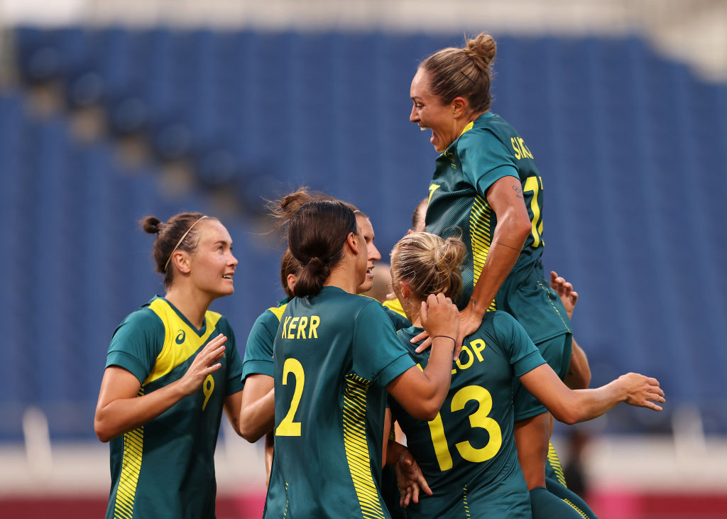 Sam Kerr #2 of Team Australia celebrates with team mates after scoring their side's second goal during the Women's First Round Group G match between Sweden and Australia on day one of the Tokyo 2020 Olympic Games at Saitama Stadium on July 24, 2021 in Saitama, Japan. (Photo by Francois Nel/Getty Images)