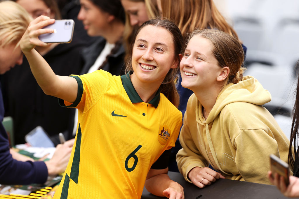 Clare Wheeler of the Matildas poses for a selfie with the crowd after game one of the series International Friendly series between the Australia Matildas and the United States of America Women's National Team at Stadium Australia on November 27, 2021 in Sydney, Australia. (Photo by Mark Kolbe/Getty Images)