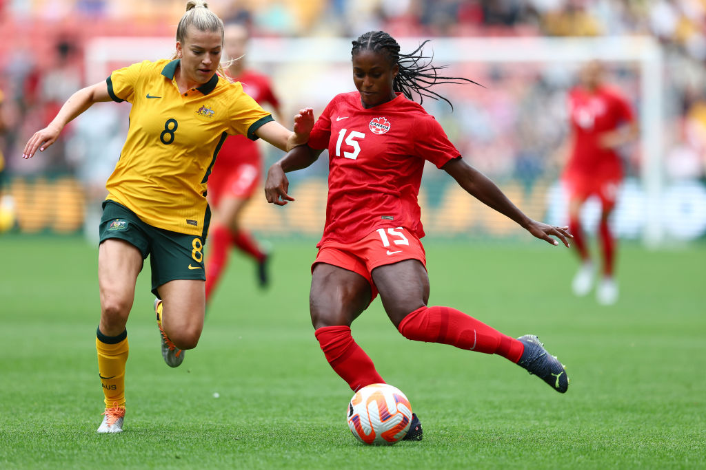 Charlotte Grant of Australia and Nichelle Prince of Canada compete for the ball during the International Women's Friendly match between the Australia Matildas and Canada at Suncorp Stadium on September 03, 2022 in Brisbane, Australia. (Photo by Chris Hyde/Getty Images)
