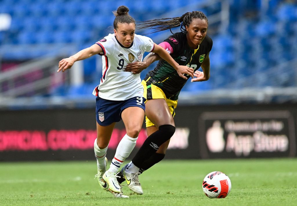 US' Mallory Pugh (L) and Jamaica's Allyson Swaby (R) vie for the ball during their 2022 Concacaf Women's Championship football match, at the BBVA Bancomer stadium in Monterrey, Nuevo Leon State, Mexico on July 7, 2022. (Photo by ALFREDO ESTRELLA / AFP) (Photo by ALFREDO ESTRELLA/AFP via Getty Images)