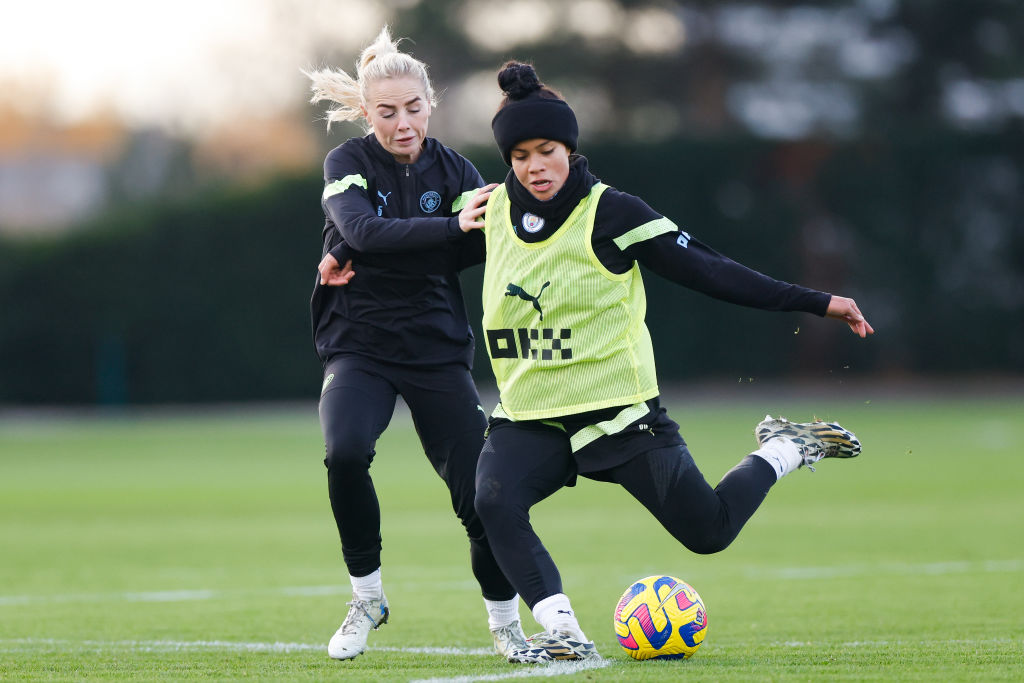 Manchester City's Alex Greenwood and Mary Fowler in action during training at Manchester City Football Academy on December 6, 2022 in Manchester, England. (Photo by Lynne Cameron - Manchester City/Manchester City FC via Getty Images)