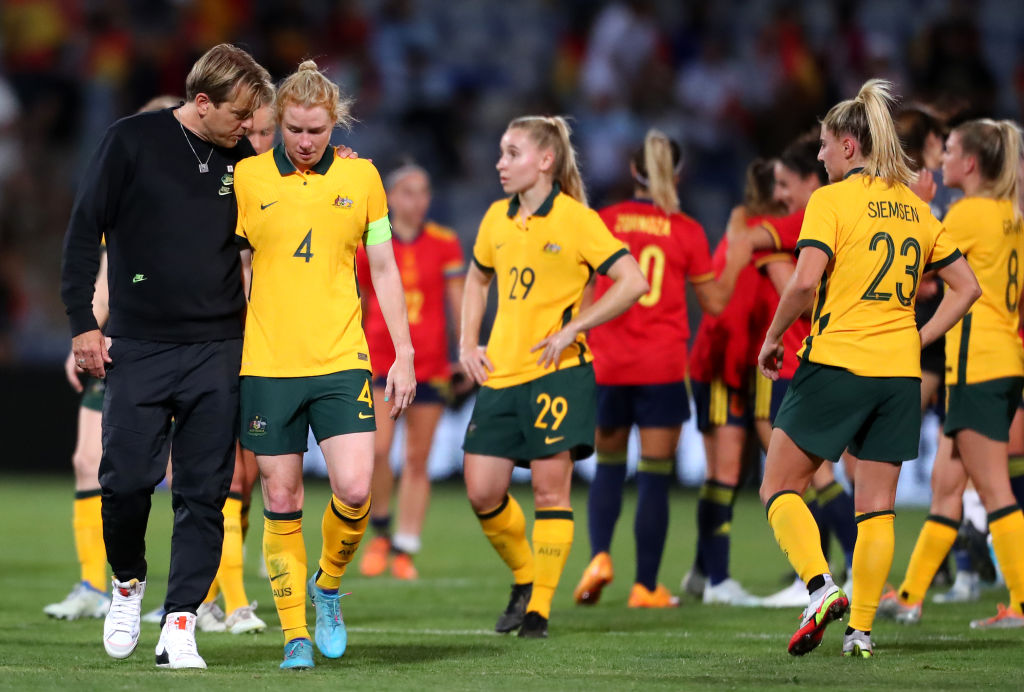 Tony Gustavsson consoles Clare Polkinghorne of Australia after their sides defeat during the Women's International Friendly match between Spain and Australia at Estadio Nuevo Colombino on June 25, 2022 in Huelva, Spain. (Photo by Fran Santiago/Getty Images)