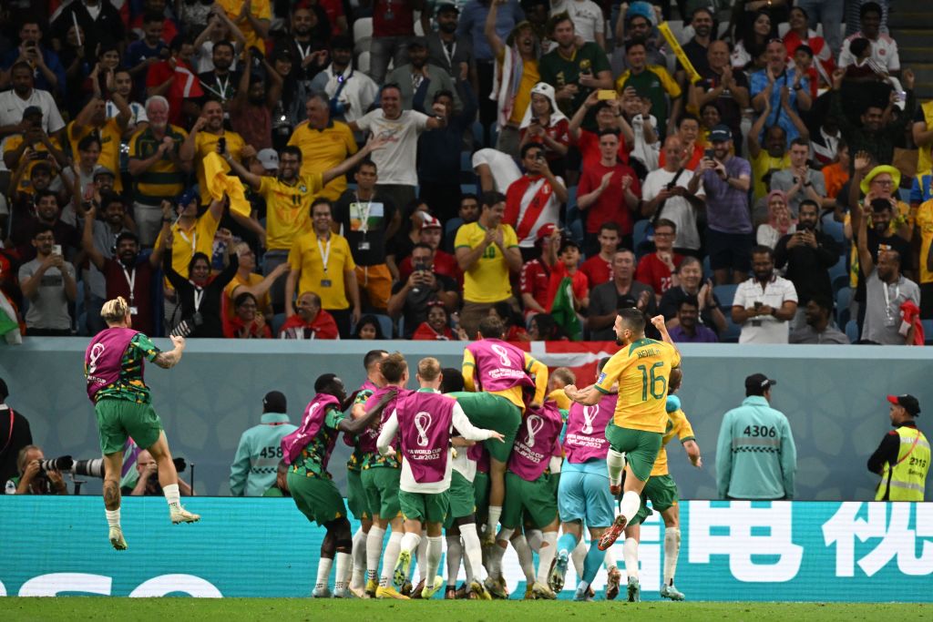 Mathew Leckie (C) celebrates with teammates after he scored his team's first goal during the Qatar 2022 World Cup Group D football match between Australia and Denmark at the Al-Janoub Stadium in Al-Wakrah, south of Doha on November 30, 2022. (Photo by NATALIA KOLESNIKOVA / AFP) (Photo by NATALIA KOLESNIKOVA/AFP via Getty Images)