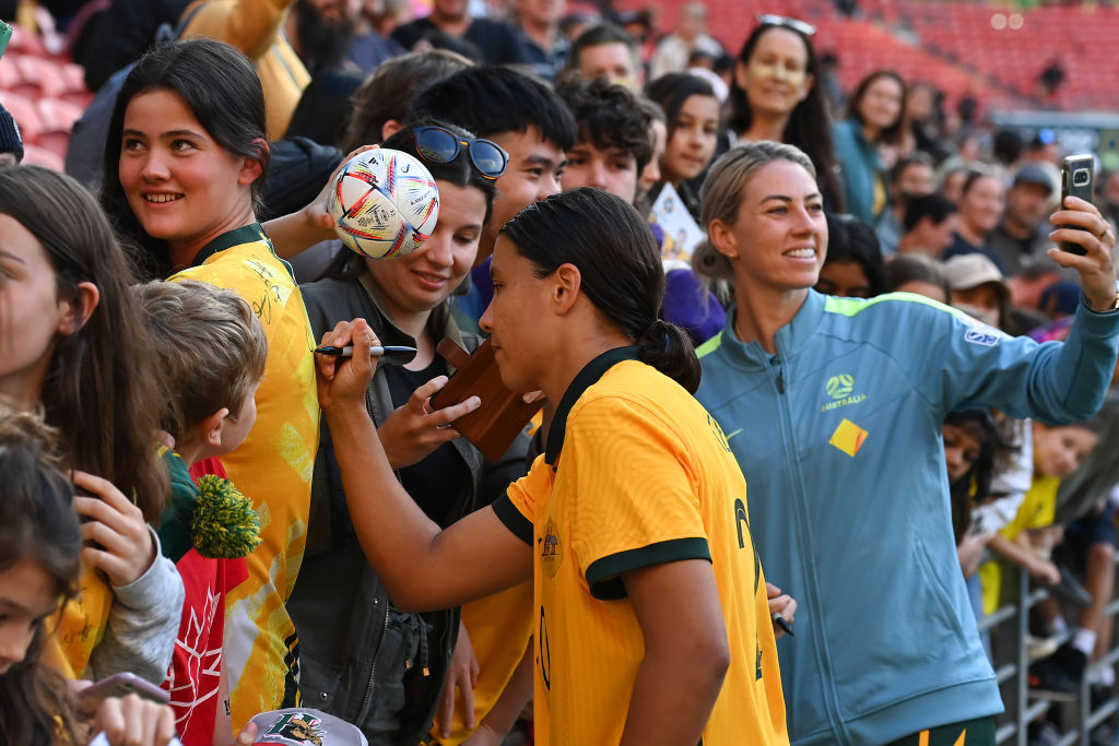Sam Kerr of Australia takes selfies with fans and signs autographs during the International Women's Friendly match between the Australia Matildas and Canada at Suncorp Stadium on September 03, 2022 in Brisbane, Australia. (Photo by Albert Perez/Getty Images)