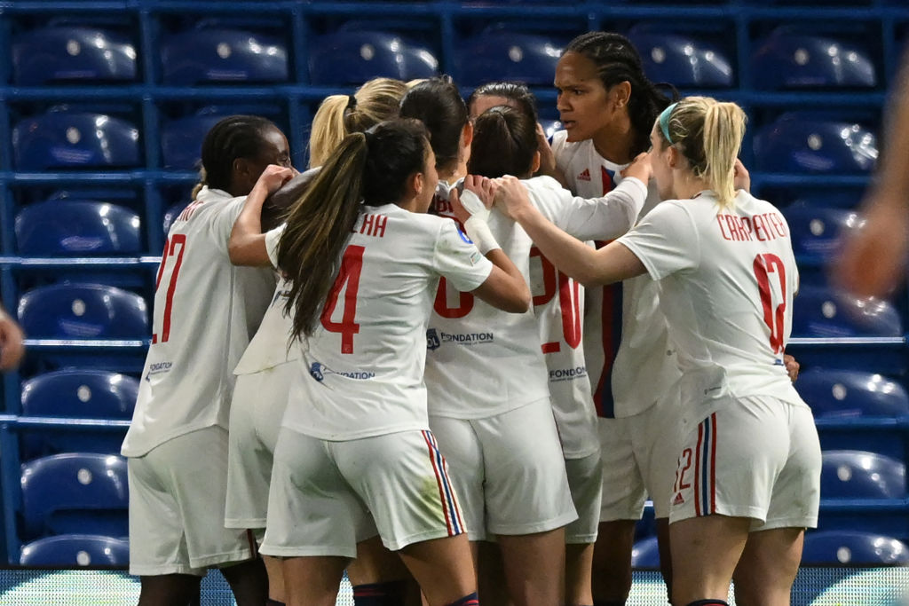 Lyon's Canadian defender Vanessa Gilles celebrates with teammates after scoring the opening goal of the UEFA Women's Champions League quarter-final second leg football match between Chelsea and Lyon at Stamford Bridge, in London, on March 30, 2023. (Photo by JUSTIN TALLIS / AFP) (Photo by JUSTIN TALLIS/AFP via Getty Images)