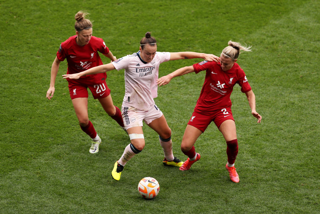Caitlin Foord of Arsenal battles for possession with Yana Daniels and Emma Koivisto of Liverpool during the FA Women's Super League match between Liverpool and Arsenal at Prenton Park on October 23, 2022 in Birkenhead, England. (Photo by Lewis Storey/Getty Images)