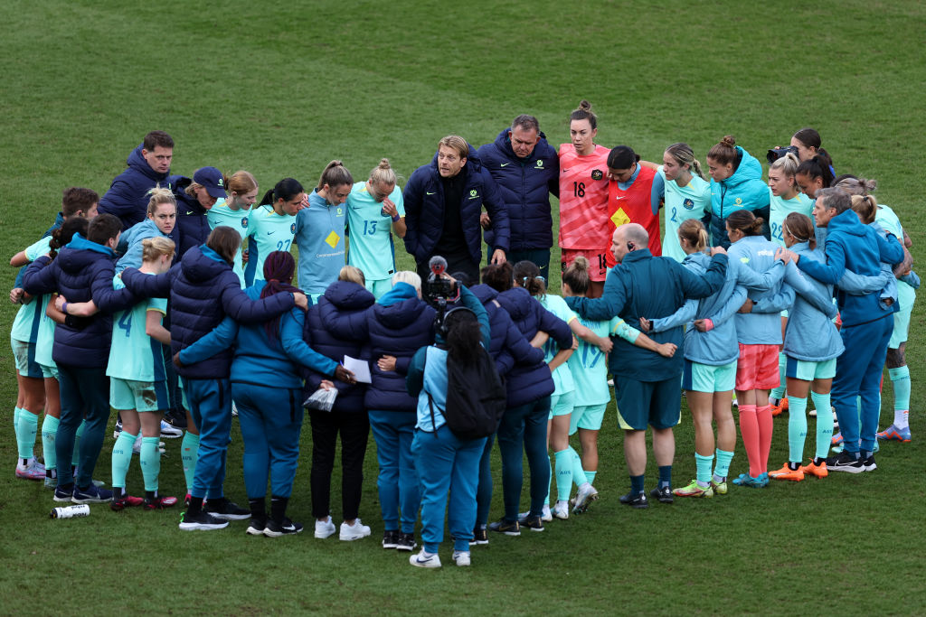 Players of Australia form a huddle as Tony Gustavsson, Head Coach of Australia speak after the Women's International Friendly match between Australia and Scotland at The Cherry Red Records Stadium on April 07, 2023 in Wimbledon, England. (Photo by Julian Players of Australia form a huddle as Tony Gustavsson, Head Coach of Australia speak after the Women's International Friendly match between Australia and Scotland at The Cherry Red Records Stadium on April 07, 2023 in Wimbledon, England. (Photo by Julian Finney/Getty Images)