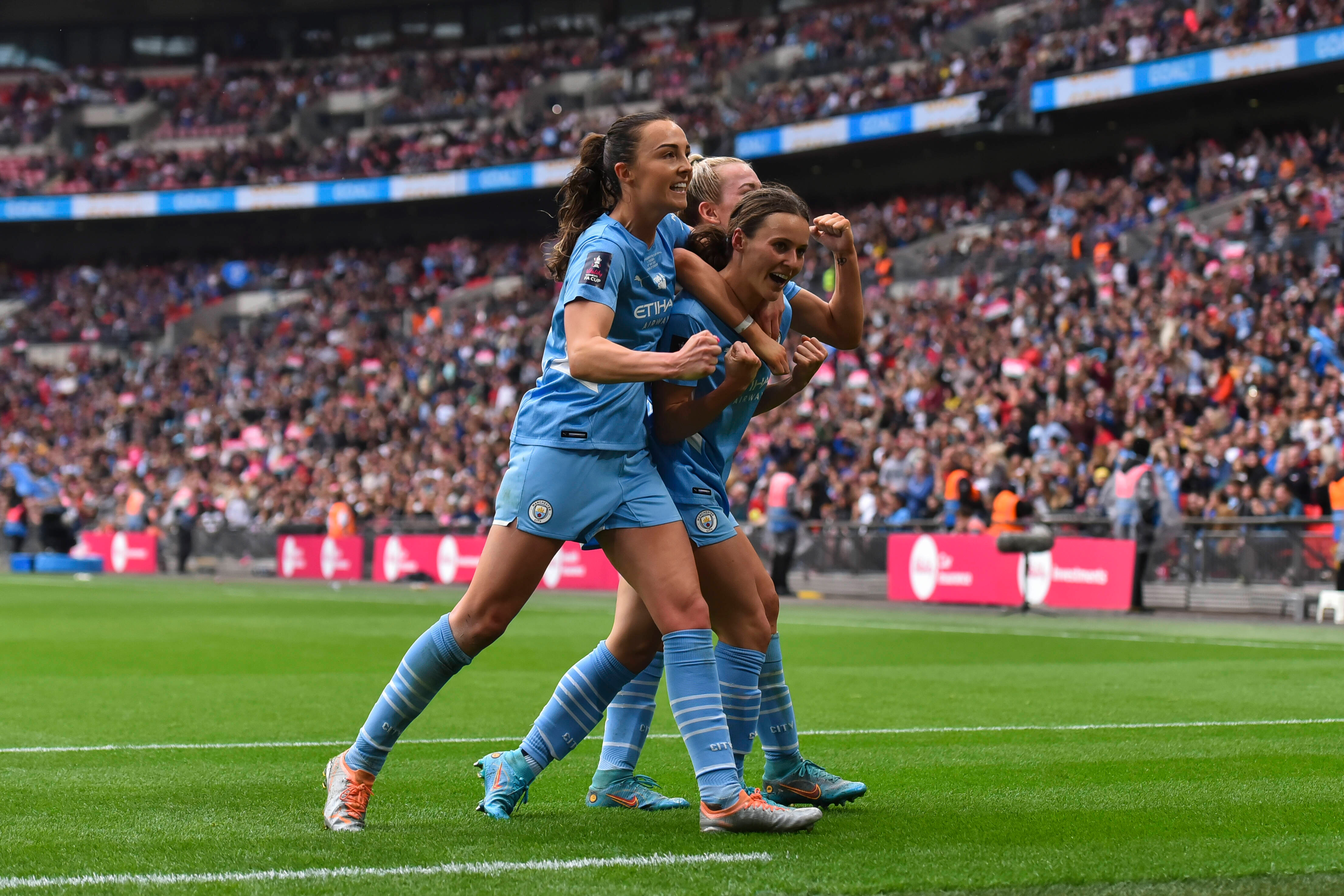 Hayley Raso of Manchester City Women celebrates their sides second goal with team mates Caroline Weir and Lauren Hemp during the Vitality Women's FA Cup Final match between Chelsea Women and Manchester City Women at Wembley Stadium on May 15, 2022 in Lond Hayley Raso of Manchester City Women celebrates their sides second goal with team mates Caroline Weir and Lauren Hemp during the Vitality Women's FA Cup Final match between Chelsea Women and Manchester City Women at Wembley Stadium on May 15, 2022 in London, England.