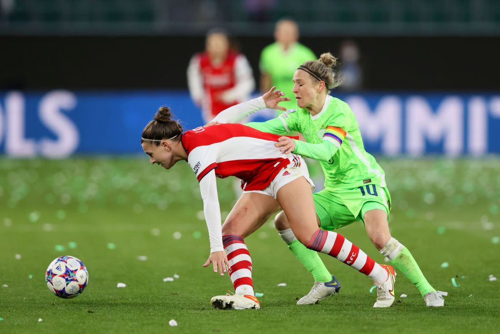 Steph Catley of Arsenal is challenged by Svenja Huth of VfL Wolfsburg during the UEFA Women's Champions League Quarter Final Second Leg match between VfL Wolfsburg and Arsenal WFC at VfL Wolfsburg Arena on March 31, 2022 in Wolfsburg, Germany. (Photo by Martin Rose/Getty Images)