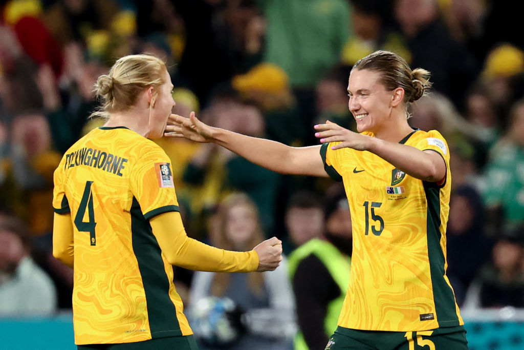 Australia's defender #15 Clare Hunt (R) and Australia's defender #04 Clare Polkinghorne celebrate after winning the Australia and New Zealand 2023 Women's World Cup Group B football match between Australia and Ireland at Stadium Australia, also known as Olympic Stadium, in Sydney on July 20, 2023. (Photo by DAVID GRAY / AFP) (Photo by DAVID GRAY/AFP via Getty Images)