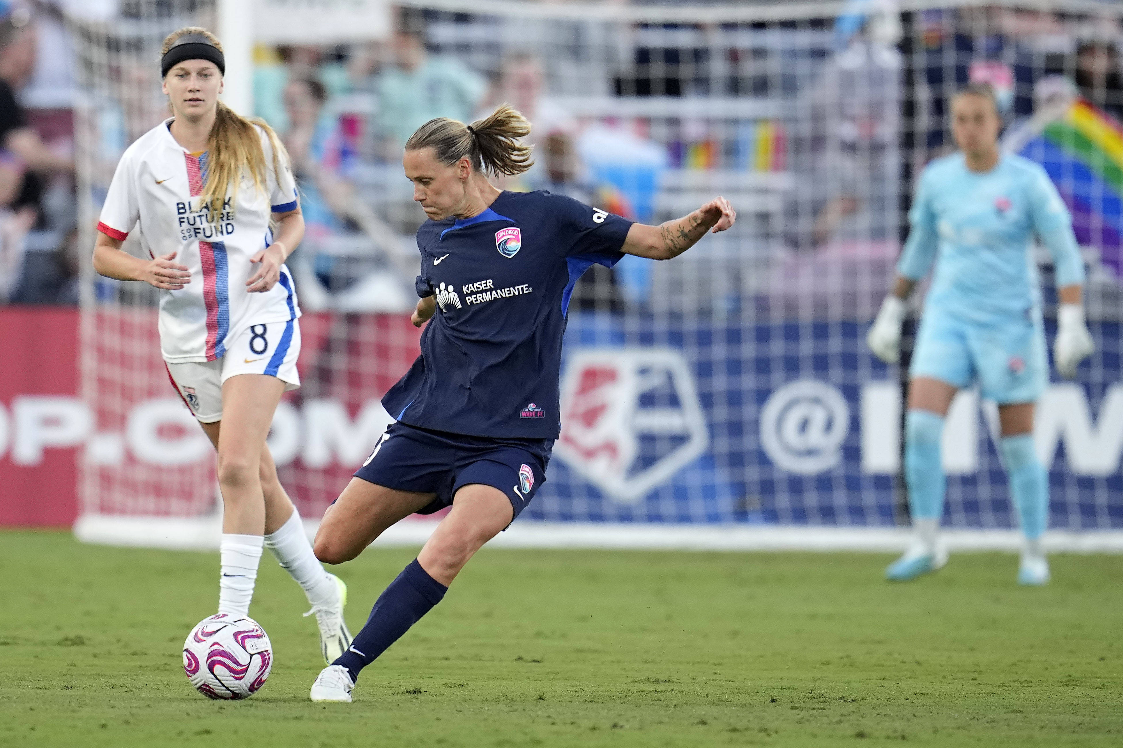 San Diego Wave FC midfielder Emily van Egmond (5) kicks the ball against OL Reign during the first half at Snapdragon Stadium.