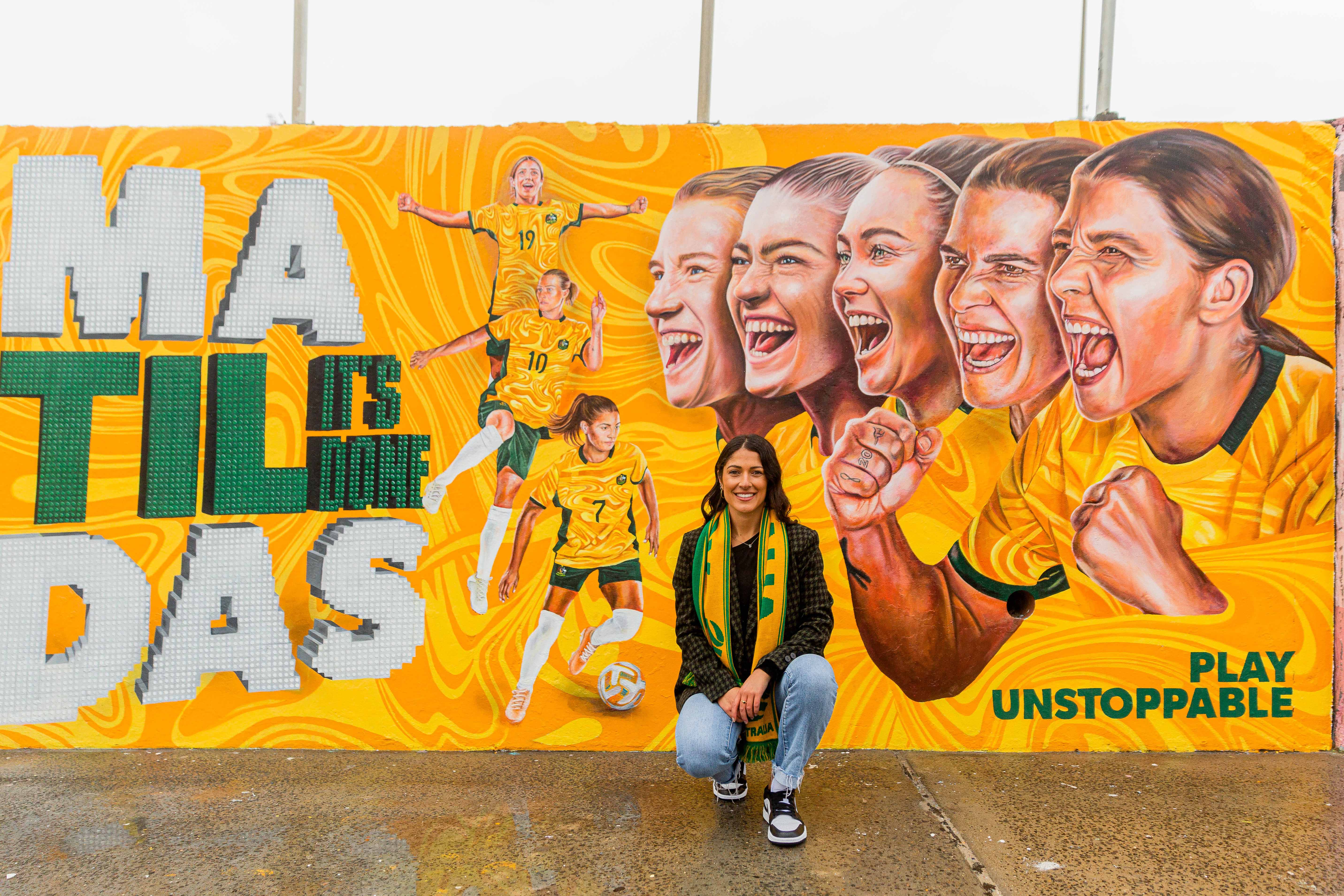 Artist Danielle Weber with the mural. (Photo: Ruby Boland)