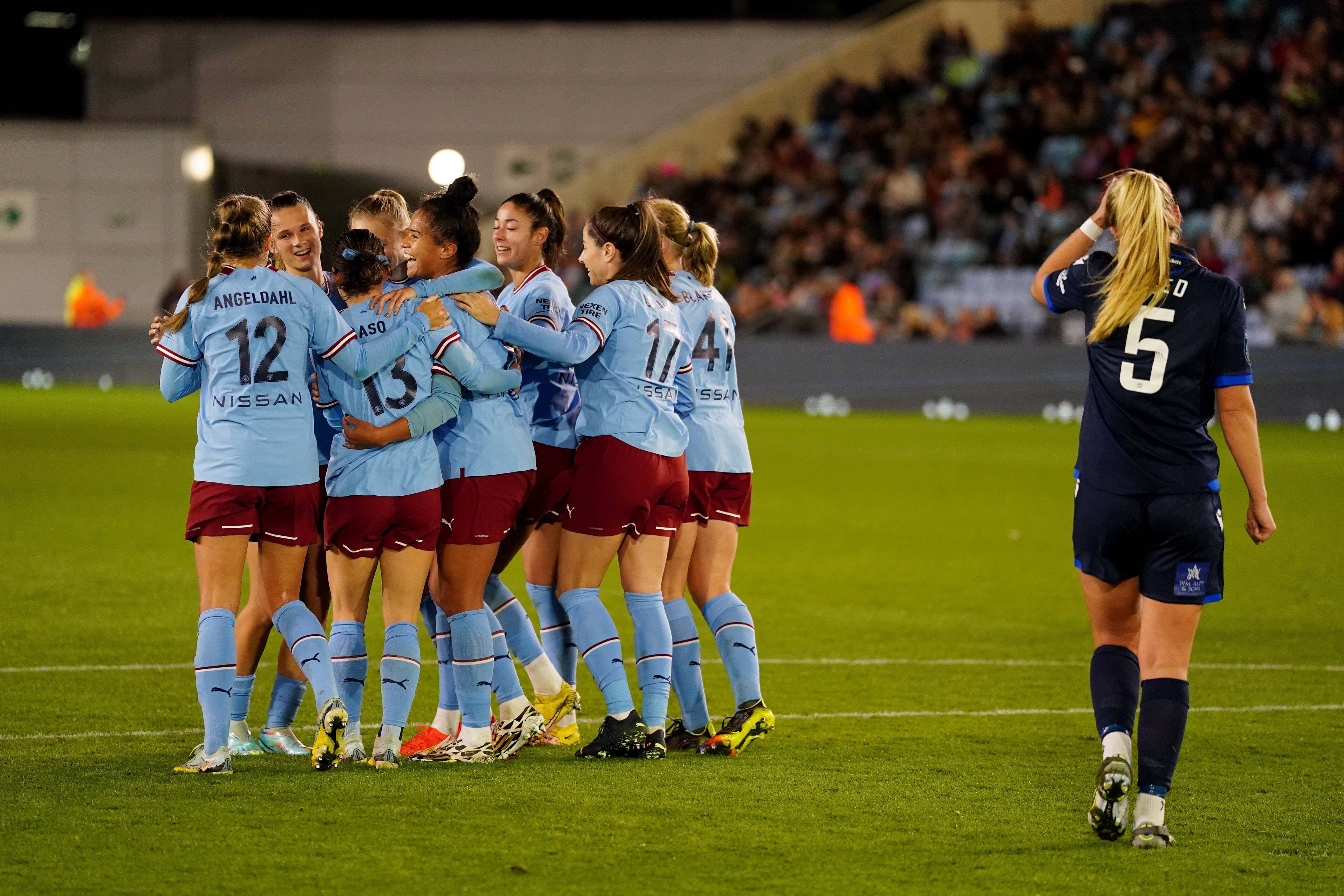 Manchester City’s Mary Fowler celebrates with teammates after scoring during the FA Women s Continental League Cup group B match at the Academy Stadium, Manchester.