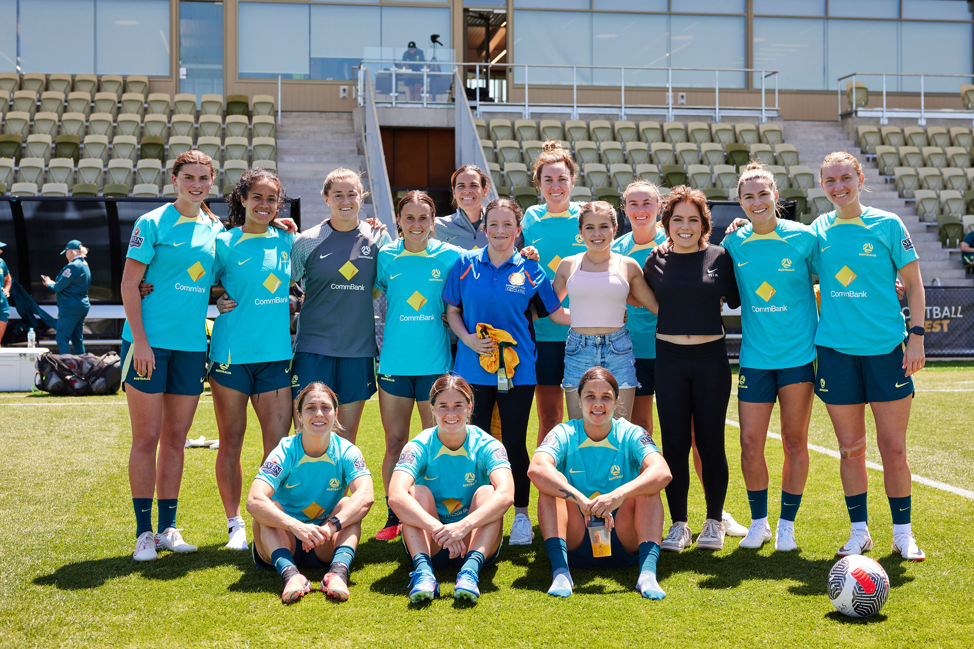 Katie (L) and Ella (R) taking a photo with the team after training. (Photo: Rachel Bach/By The White Line)