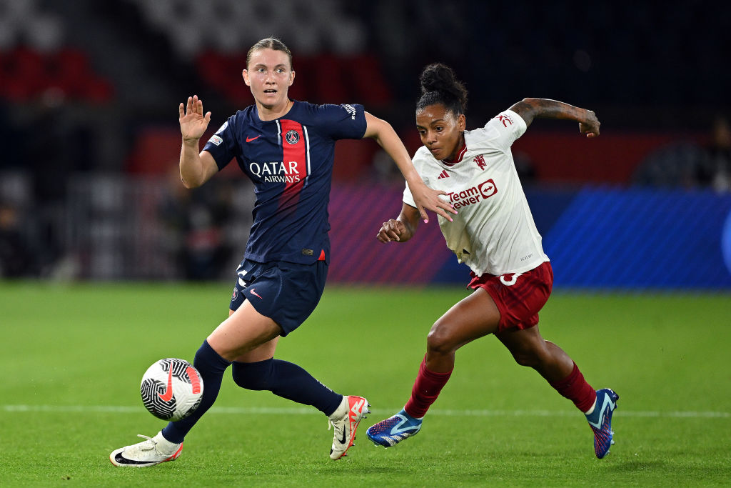 Clare Hunt of Paris Saint-Germain is tackled by Geyse of Manchester United during the UEFA Women's Champions League Qualifying Round 2 Second Leg match between Paris Saint-Germain and Manchester United at Parc des Princes on October 18, 2023 in Paris, France. (Photo by Mike Hewitt/Getty Images)