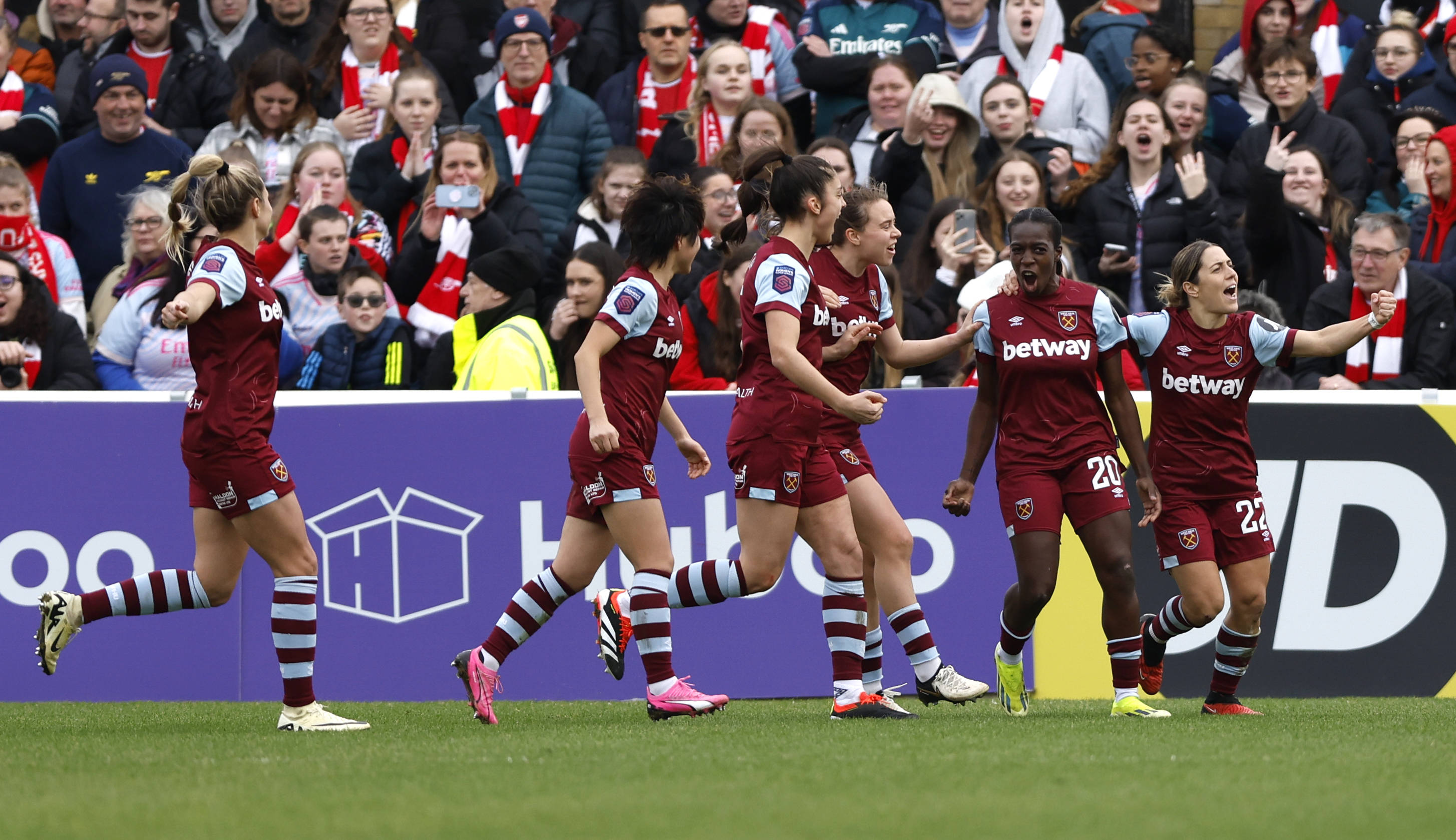 Viviane Asseyi (second right) celebrates scoring their side s first goal of the game with team-mates during the Barclays Women s Super League match at the Chigwell Construction Stadium, London.