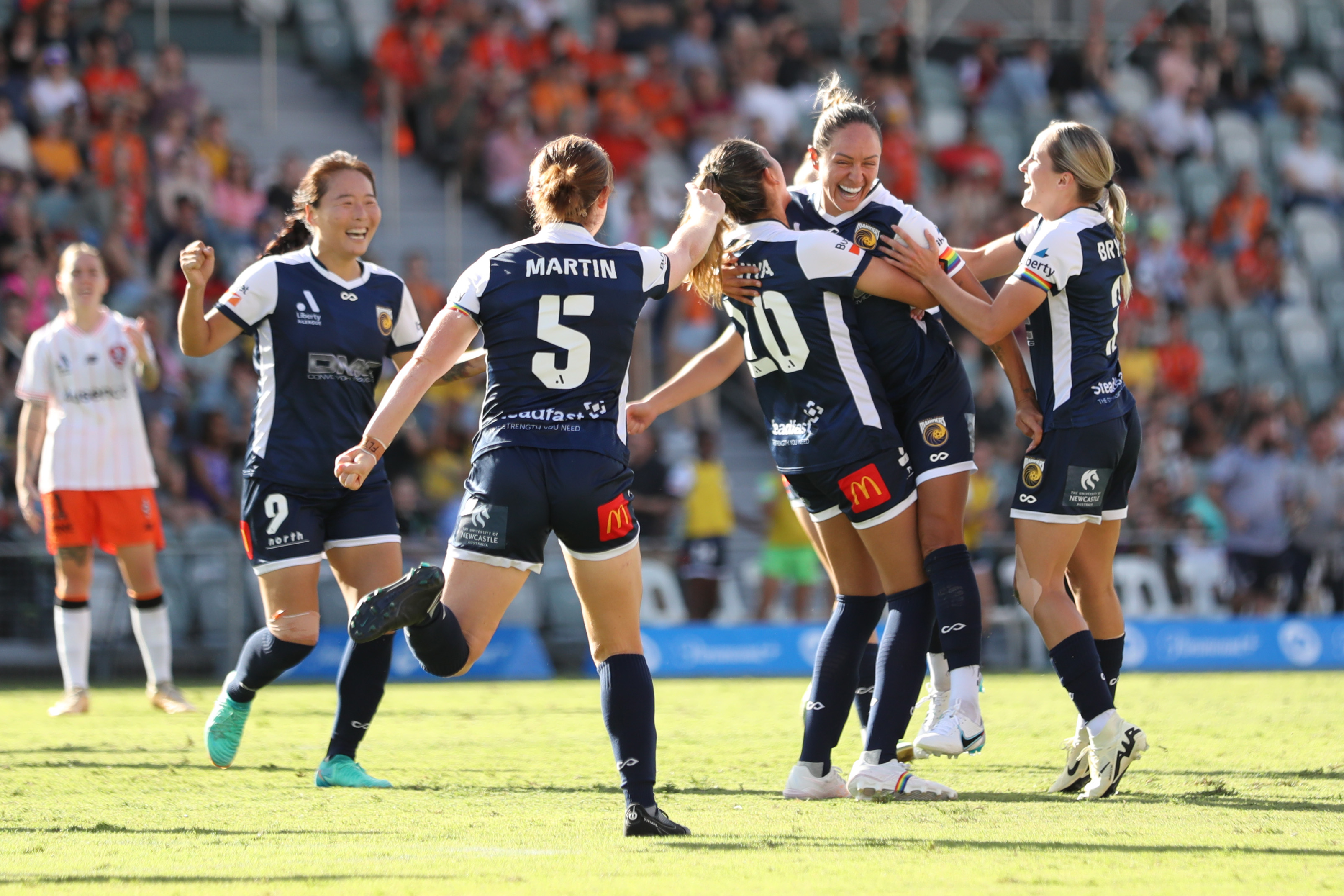 The Central Coast Mariners celebrate a goal during the A-League Women round 19 match between Brisb ane Roar and Central Coast Mariners at Ballymore Stadium, on March 09, 2024, in Brisbane, Australia. (Photo by Mackenzie Sweetnam/Getty Images)