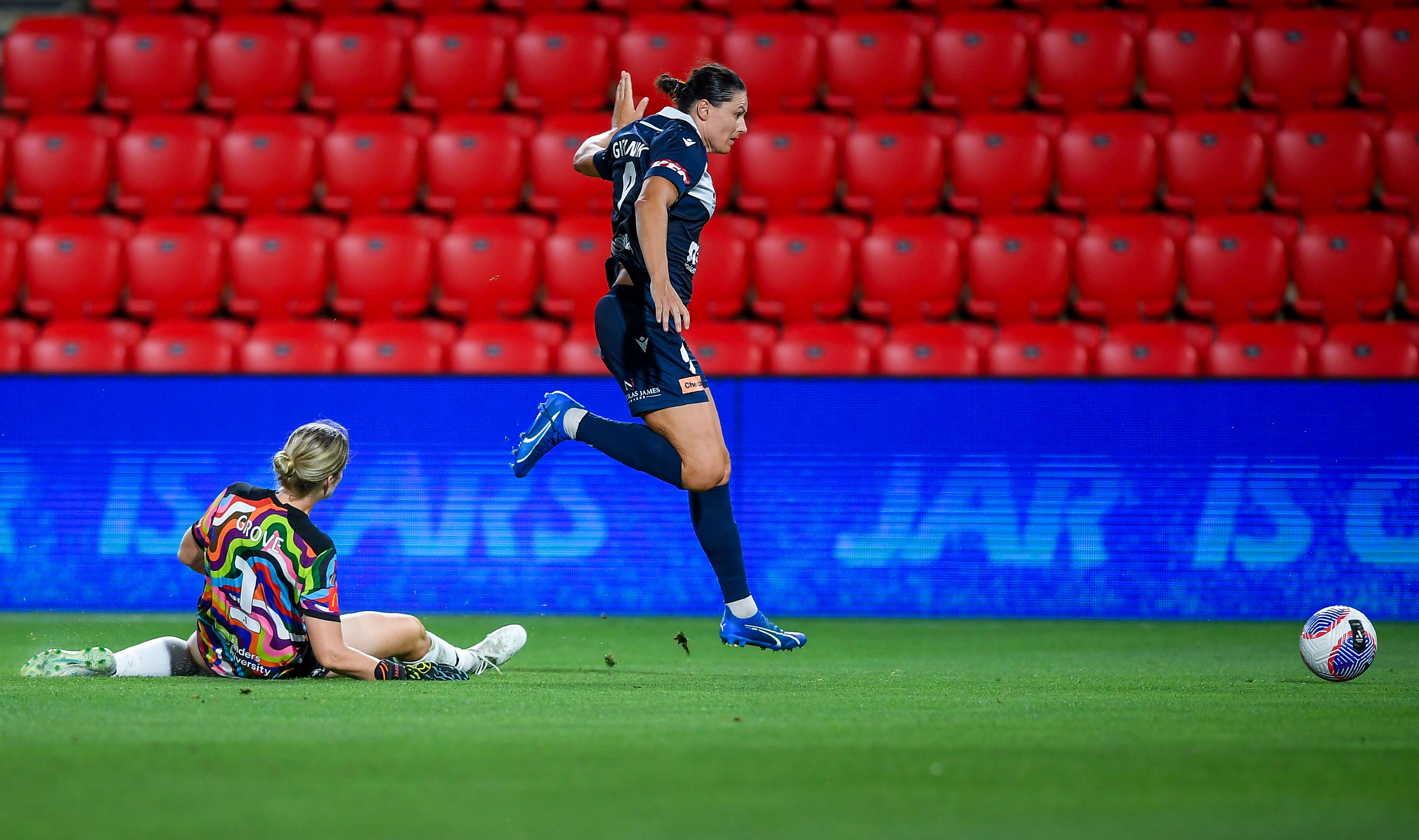 Emily Gielnik of the Victory clears over Annalee Grove goalkeeper of Adelaide United during the A-League Women round 19 match between Adelaide United and Melbourne Victory at Coopers Stadium, on March 10, 2024, in Adelaide, Australia. (Photo by Mark Brake/Getty Images)