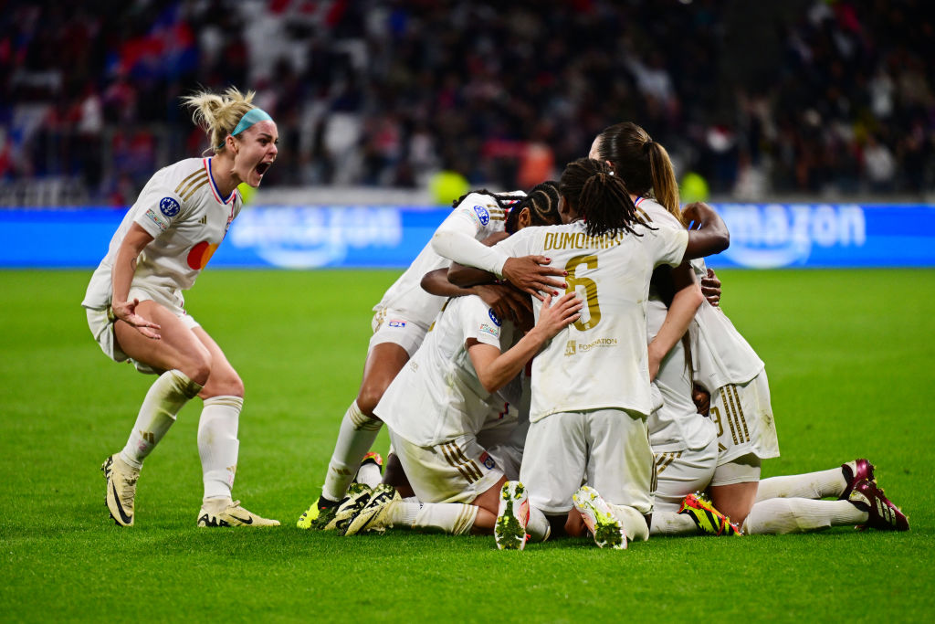 Melchie Dumornay celebrates with teammates during the UEFA Women's Champions League semi-final leg 1 of 2 football match between Olympique Lyonnais (OL) and Paris Saint-Germain (PSG) at the Parc Olympique Lyonnais stadium in Decines-Charpieu, central-eastern France, on April 20, 2024. (Photo by Olivier CHASSIGNOLE / AFP) (Photo by OLIVIER CHASSIGNOLE/AFP via Getty Images)