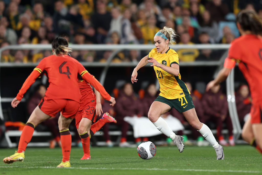 SYDNEY, AUSTRALIA - JUNE 03: Ellie Carpenter of Australia and Dou Jiazing of China compete for the ball during the international friendly match between Australia Matildas and China PR at Accor Stadium on June 03, 2024 in Sydney, Australia. (Photo by Matt King/Getty Images)