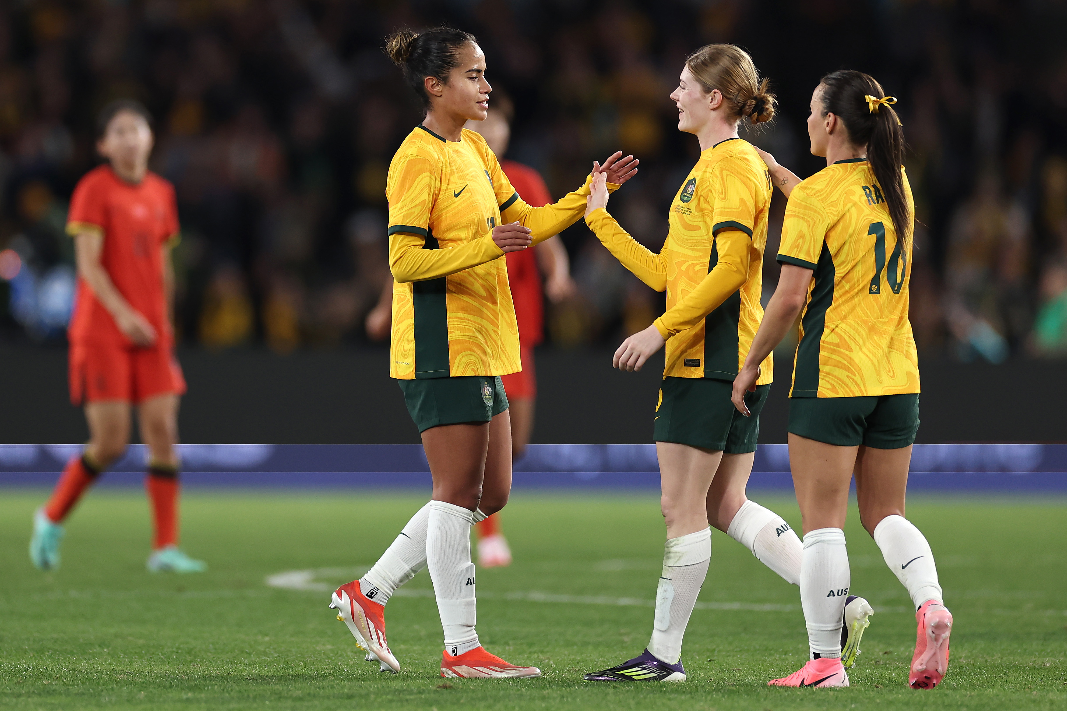Mary Fowler, Hayley Raso and Cortnee Vine of Australia celebrate winning the international friendly match between Australia Matildas and China PR at Accor Stadium on June 03, 2024 in Sydney, Australia. (Photo by Cameron Spencer/Getty Images)