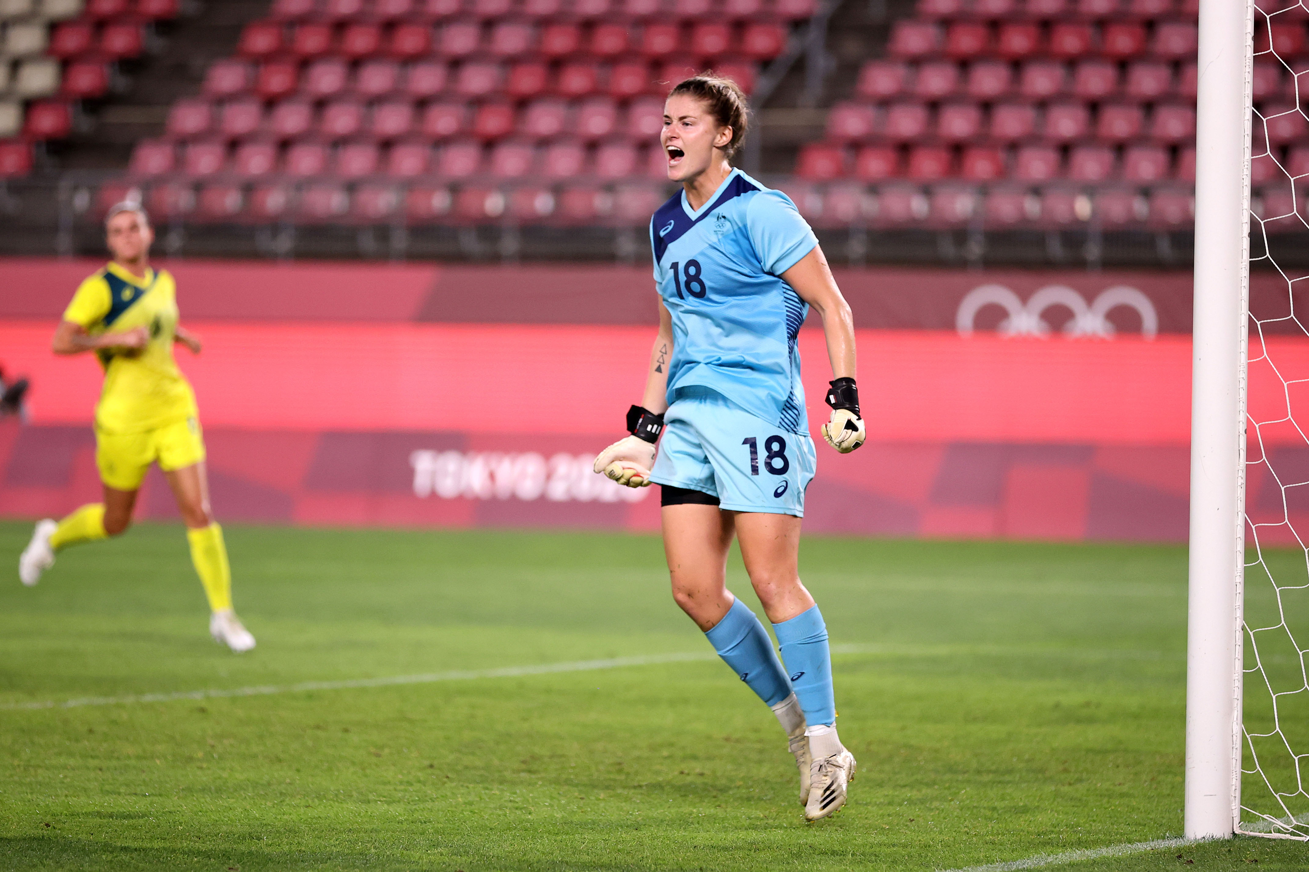 Teagan Micah #18 of Team Australia celebrates after saving a penalty from Caroline Weir #11 of Team Great Britain during the Women's Quarter Final match between Great Britain and Australia on day seven of the Tokyo 2020 Olympic Games at Kashima Stadium on July 30, 2021 in Kashima, Ibaraki, Japan. (Photo by Hector Vivas - FIFA/FIFA via Getty Images)
