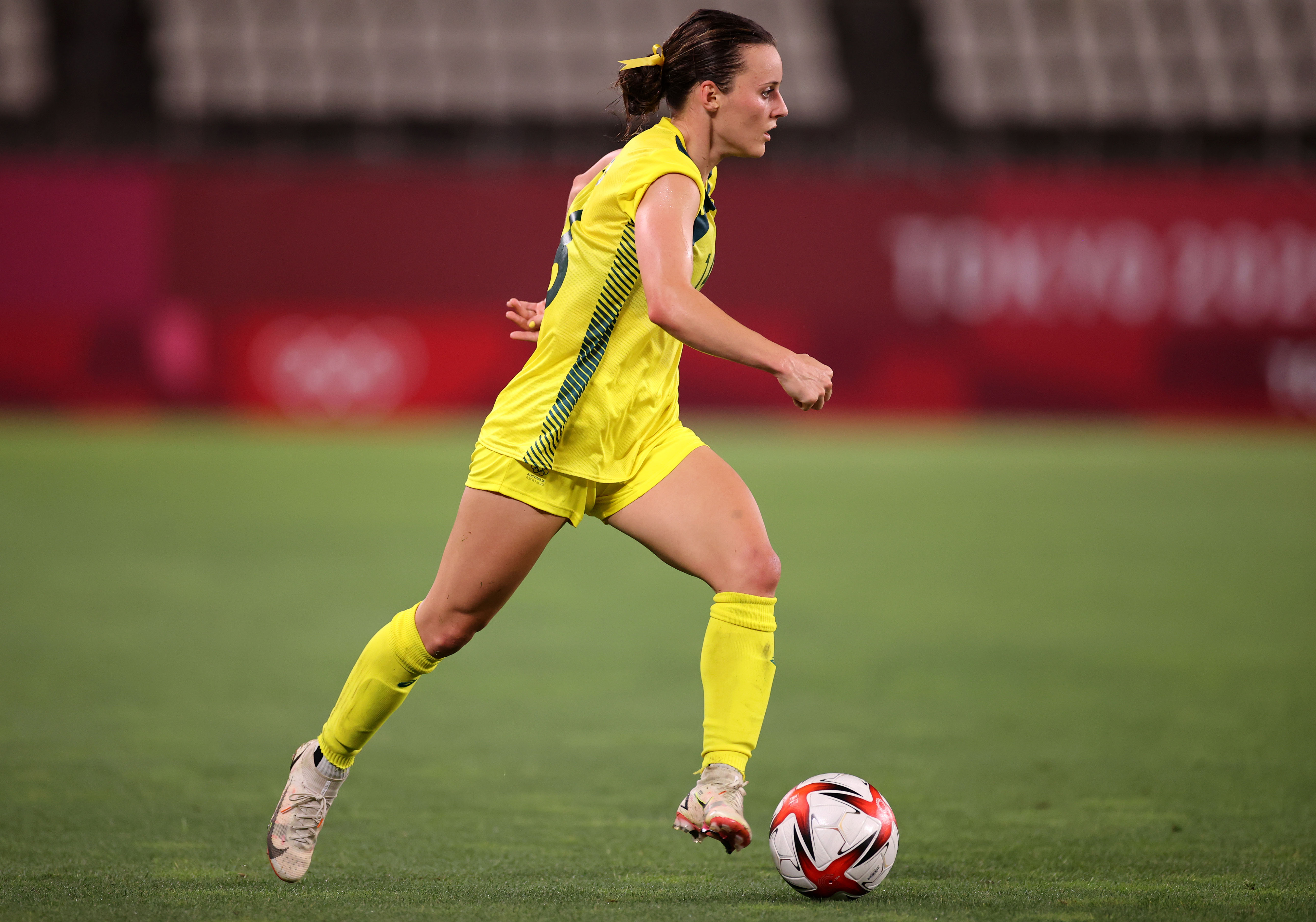 Hayley Raso #16 of Team Australia runs with the ball during the Women's Quarter Final match between Great Britain and Australia on day seven of the Tokyo 2020 Olympic Games at Kashima Stadium on July 30, 2021 in Kashima, Ibaraki, Japan. (Photo by Hector Vivas - FIFA/FIFA via Getty Images)