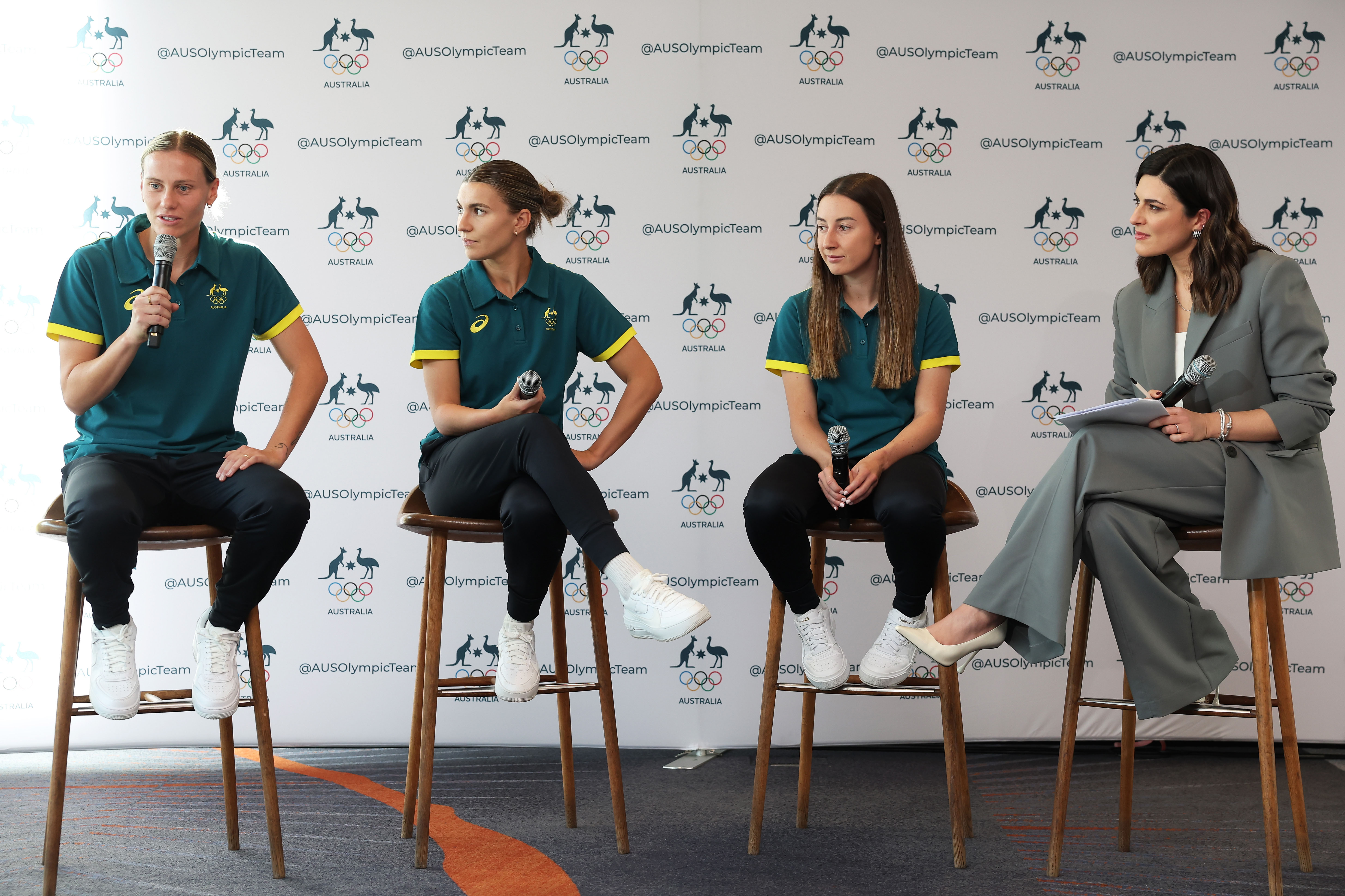 (L-R) Emily Van Egmond, Steph Catley and Clare Wheeler of Australia speak on stage during the Australian 2024 Paris Olympic Games Women's Football Squad Announcement at Sydney Olympic Park Sports Centre on June 04, 2024 in Sydney, Australia. (Photo by Matt King/Getty Images)