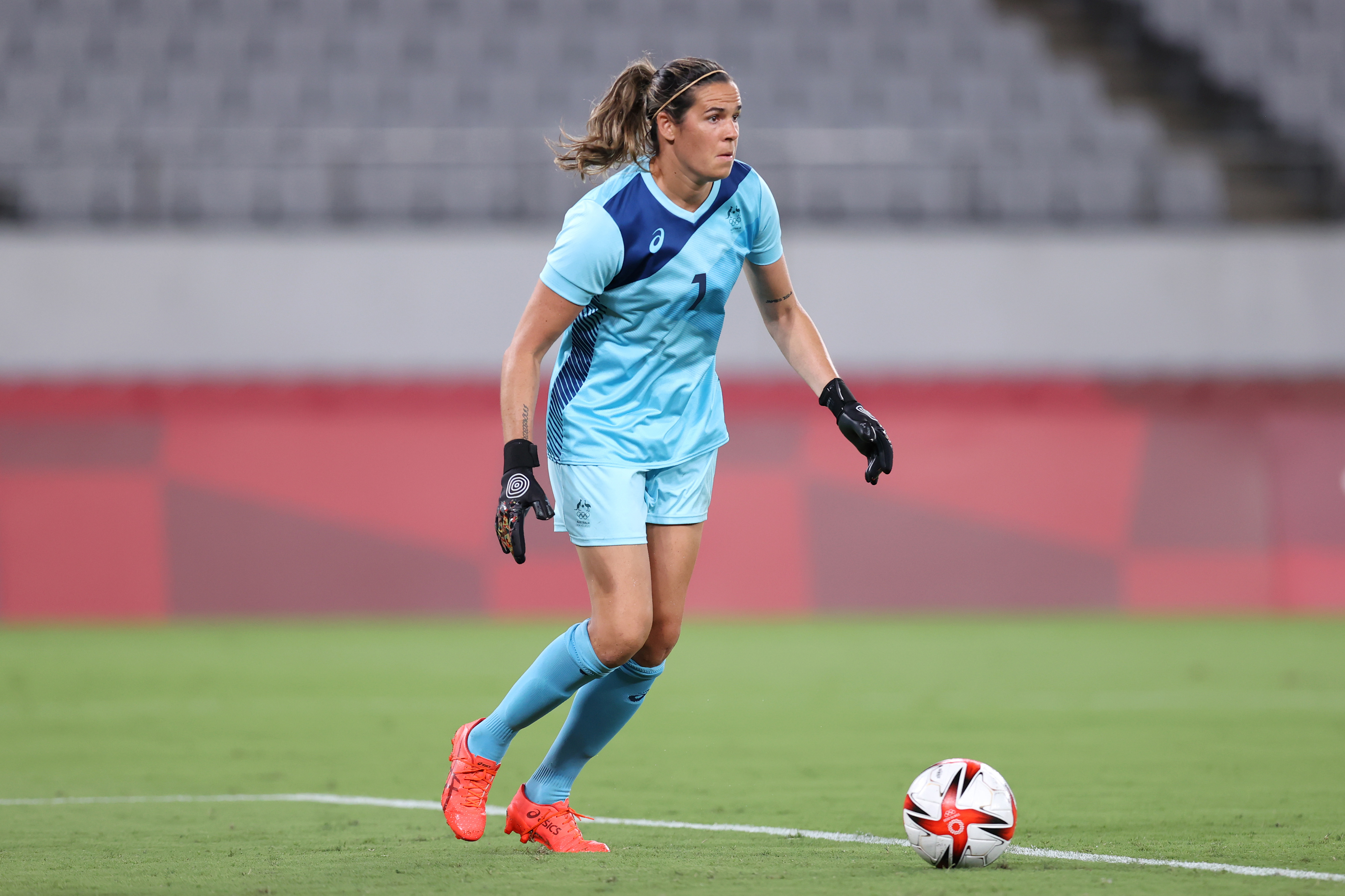 Lydia Williams #1 of Team Australia makes a pass during the Women's First Round Group G match between Australia and New Zealand during the Tokyo 2020 Olympic Games at Tokyo Stadium on July 21, 2021 in Chofu, Tokyo, Japan. (Photo by Alex Grimm - FIFA/FIFA via Getty Images)