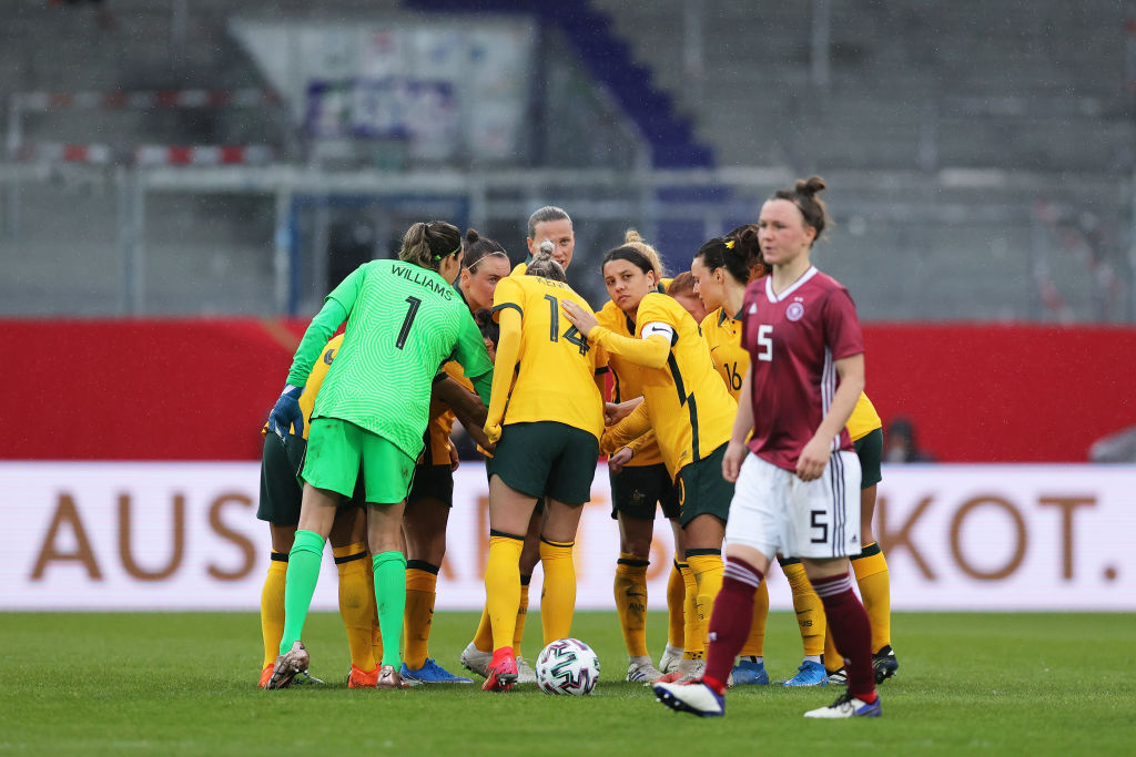 Sam Kerr of Australia looks out during a team huddle in the Women's International Friendly match between Germany and Australia at BRITA-Arena on April 10, 2021 in Wiesbaden, Germany. Sporting stadiums around Germany remain under strict restrictions due to the Coronavirus Pandemic as Government social distancing laws prohibit fans inside venues resulting in games being played behind closed doors. (Photo by Joosep Martinson/Getty Images)