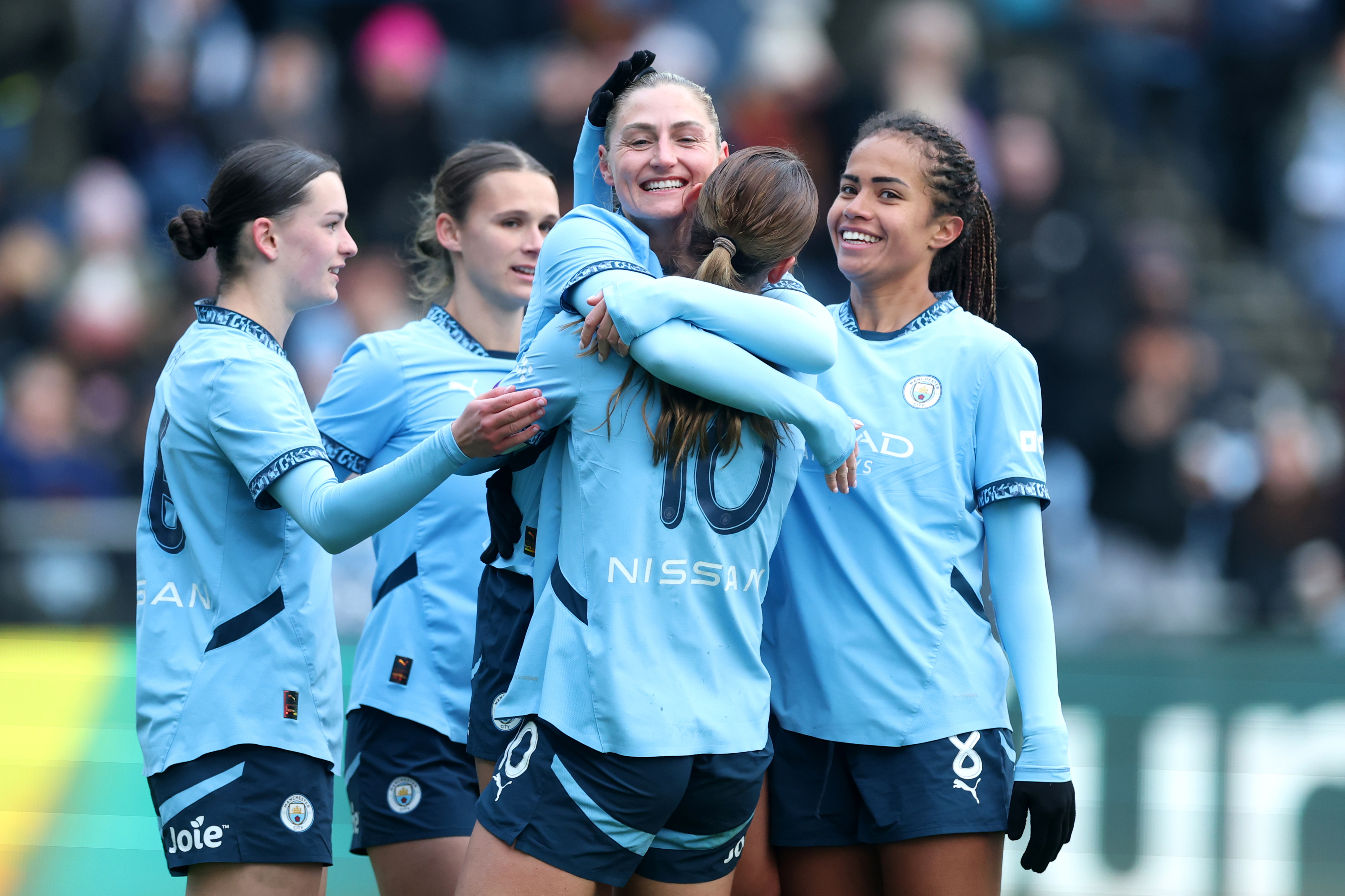 Laura Coombs of Manchester City celebrates scoring her team's second goal with teammates during The Adobe Women's FA Cup Fourth Round match between Manchester City and Ipswich Town at Joie Stadium on January 12, 2025 in Manchester, England. (Photo by Carl Recine/Getty Images)