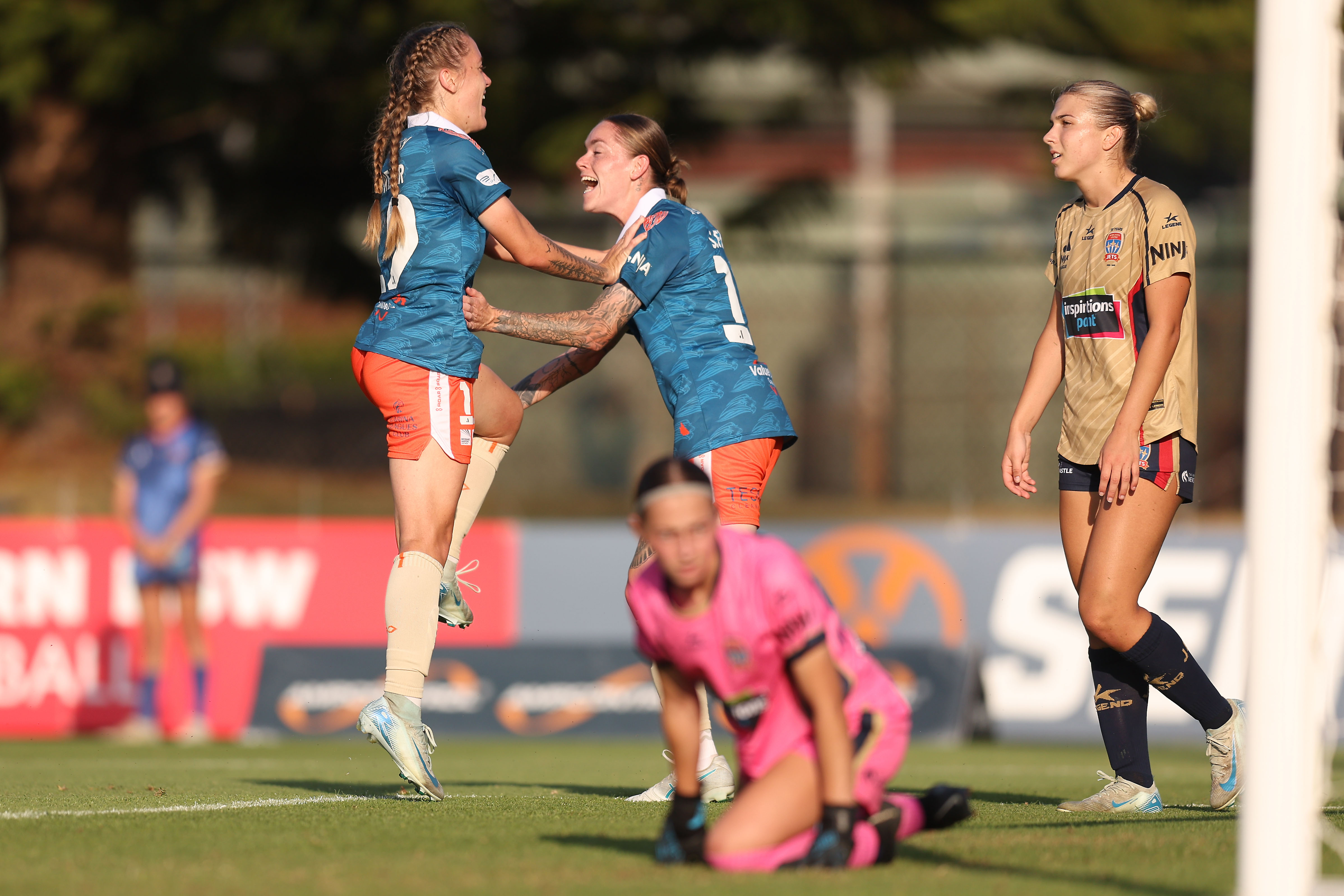 Laini Freier of the Roar celebrates a goal with Sharn Freier of the Roar during the round seven A-League Women's match between Newcastle Jets and Brisbane Roar at No. 2 Sports Ground, on December 21, 2024, in Newcastle, Australia. (Photo by Scott Gardiner/Getty Images)