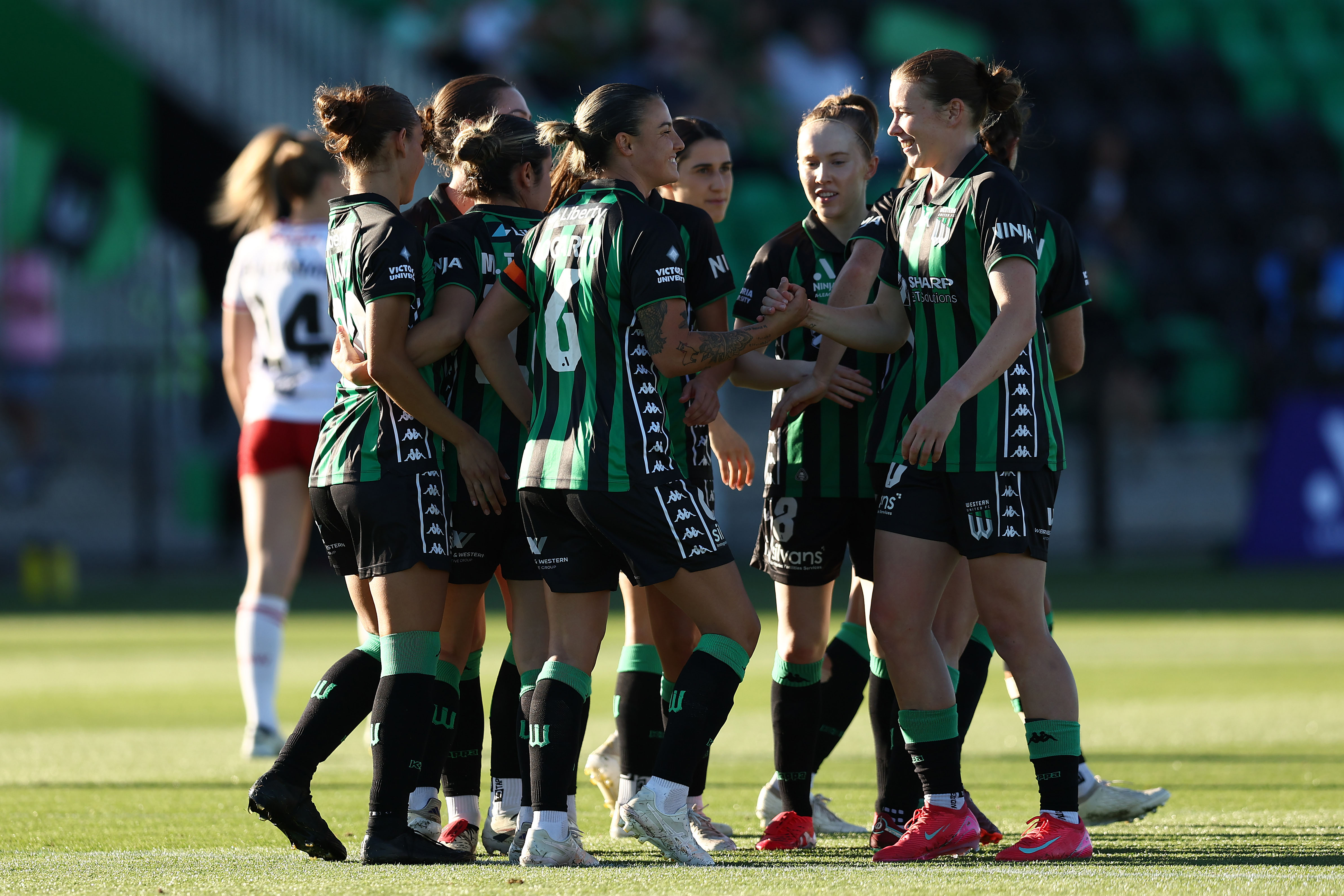 Chloe Logarzo of Western United celebrates with teammates after scoring a penalty during the round 14 A-League Women's match between Western United and Western Sydney Wanderers at Ironbark Fields on January 31, 2025 in Melbourne, Australia. (Photo by Graham Denholm/Getty Images)