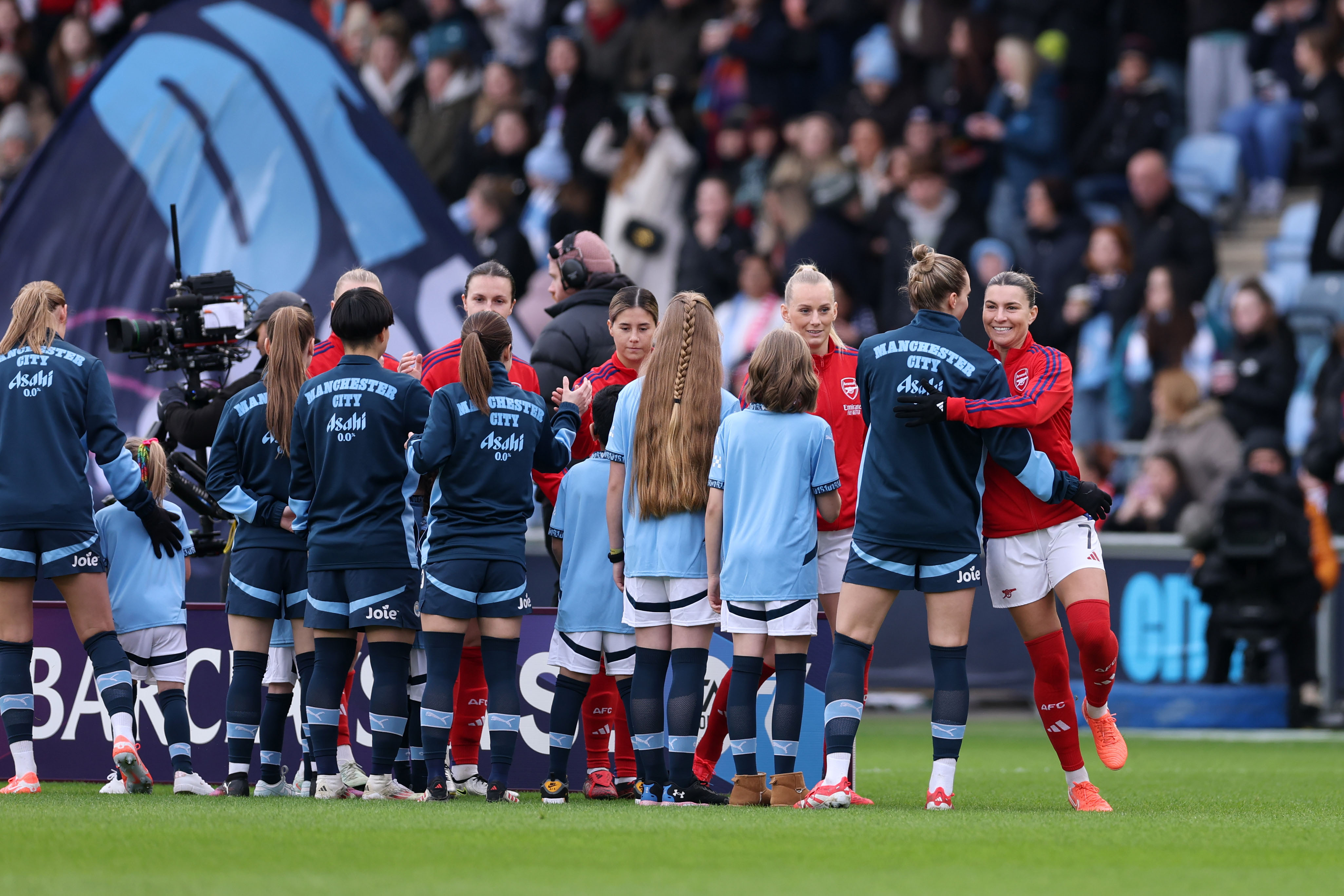 Vivianne Miedema of Manchester City hugs Steph Catley of Arsenal ahead of the Barclays Women's Super League match between Manchester City and Arsenal FC at Joie Stadium on February 02, 2025 in Manchester, England. (Photo by Naomi Baker/Getty Images)