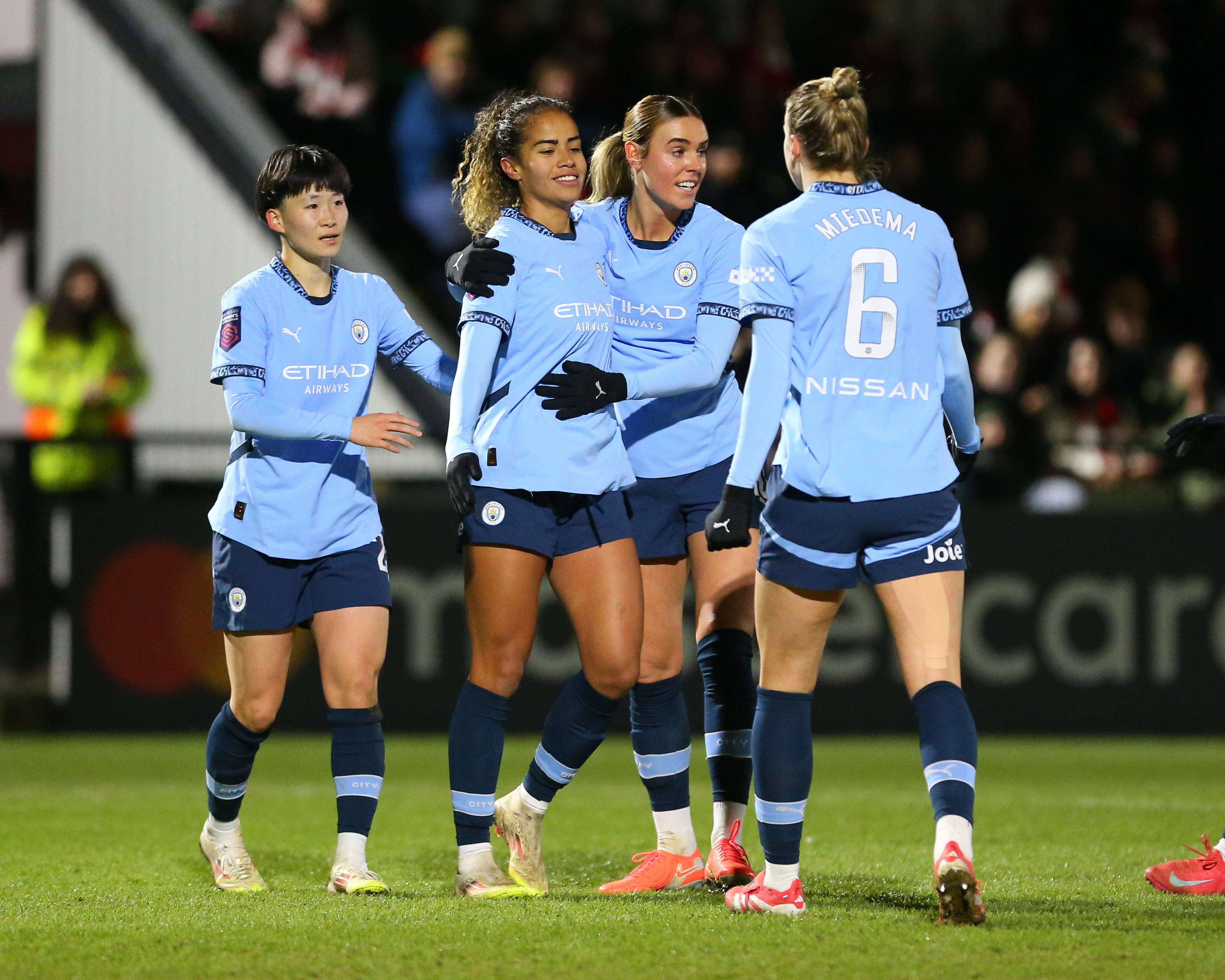 Players of Manchester City celebrate with goalscorer Mary Fowler (8 Manchester City) during the Subway Womens League Cup game between Arsenal and Manchester City at Mangata Pay UK Stadium Meadow Park in Borehamwood, England. (Jay Patel SPP)