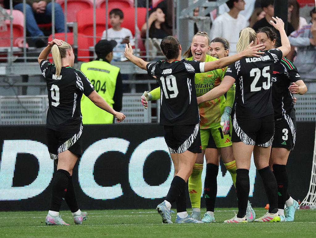 Caitlin Foord, Daphne Van Domselaar and team mates of Arsenal celebrate victory following the UEFA Women's Champions League semifinal second leg match between Olympique Lyonnais and Arsenal WFC at OL Stadium on April 27, 2025 in Decines-Charpieu, France. (Photo by Catherine Steenkeste/Getty Images)