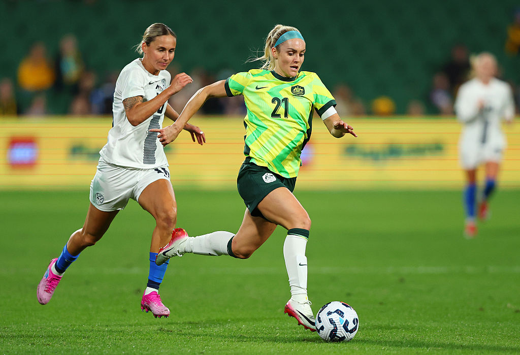 UNE 26: Ellie Carpenter of Australia runs with the ball whilst under pressure Kaja Erzen of Slovenia during the International Friendly match between Australia Matildas and Slovenia at HBF Park on June 26, 2025 in Perth, Australia. (Photo by Paul Kane/Getty Images)