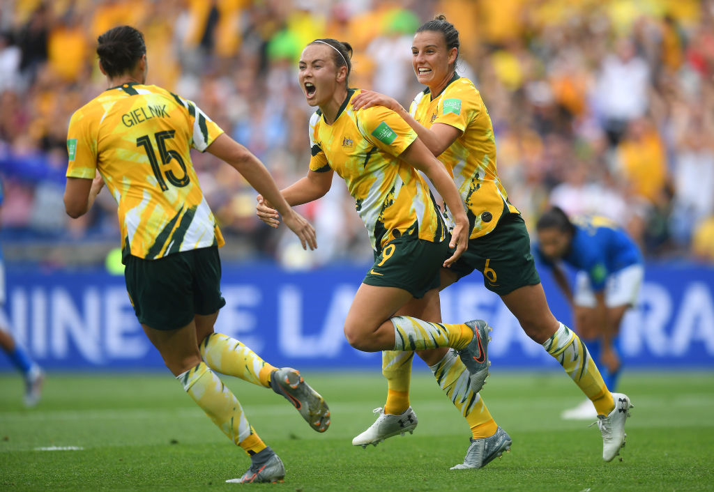 MONTPELLIER, FRANCE - JUNE 13: Caitlin Foord of Australia celebrates with teammates after scoring her team's first goal during the 2019 FIFA Women's World Cup France group C match between Australia and Brazil at Stade de la Mosson on June 13, 2019 in Montpellier, France. (Photo by Michael Regan/Getty Images)
