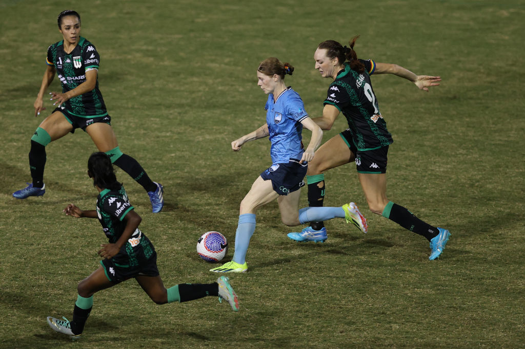 SYDNEY, AUSTRALIA - MARCH 09: Cortnee Vine of Sydney FC is challenged by Hannah Keane of Western United during the A-League Women round 19 match between Sydney FC and Western United at Leichhardt Oval on March 09, 2024 in Sydney, Australia. (Photo by Jason McCawley/Getty Images)