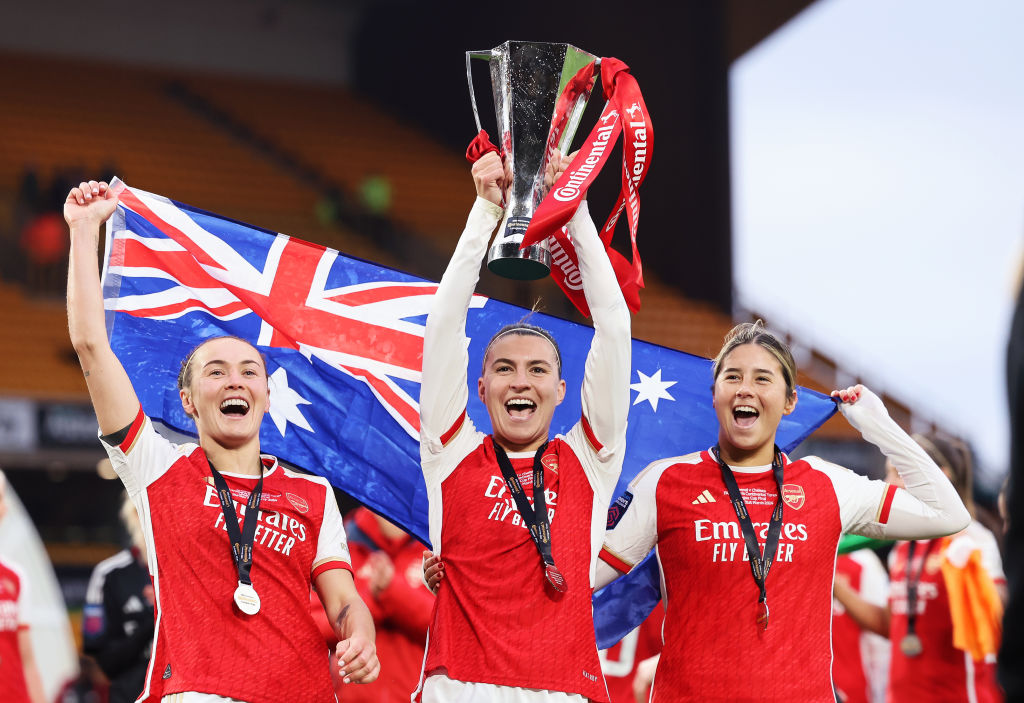 WOLVERHAMPTON, ENGLAND - MARCH 31: Caitlin Foord, Steph Catley and Kyra Cooney-Cross of Arsenal celebrate by lifting the Continental Tyres League Cup Trophy after their team's victory during the FA Women's Continental Tyres League Cup Final match between Arsenal and Chelsea at Molineux on March 31, 2024 in Wolverhampton, England. (Photo by Matt McNulty/Getty Images) (Photo by Matt McNulty/Getty Images)
