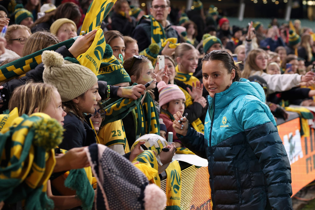 ADELAIDE, AUSTRALIA - MAY 31: Haley Raso of the Matildas signs autographs for fans following the international friendly match between Australia Matildas and China PR at Adelaide Oval on May 31, 2024 in Adelaide, Australia. (Photo by Cameron Spencer/Getty Images