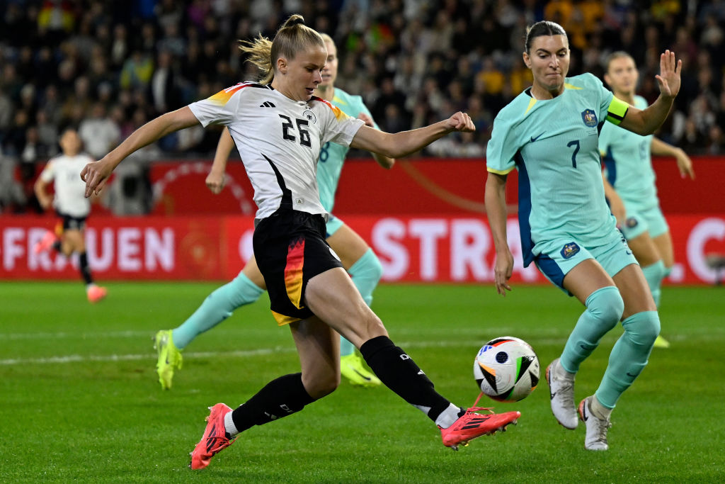 Germany's forward Vivien Endemann (L) shoots past Australia's defender Steph Catley during the women's friendly football match Germany vs Australia in Duisburg, western Germany on October 28, 2024. (Photo by INA FASSBENDER / AFP) (Photo by INA FASSBENDER/AFP via Getty Images)