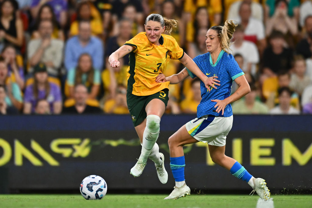 BRISBANE, AUSTRALIA - NOVEMBER 28: Winonah Heatley of Australia controls the ball under pressure from Giovana Queiroz Costa Garbelini of Brazil during the International Friendly match between the Matildas and Brazil at Suncorp Stadium on November 28, 2024 in Brisbane, Australia. (Photo by Albert Perez/Getty Images)