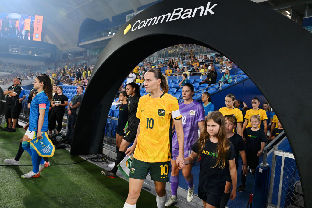 GOLD COAST, AUSTRALIA - DECEMBER 01: Emily van Egmond of Australia leads her team out onto the field prior to the International Friendly match between the Matildas and Brazil at Cbus Super Stadium on December 01, 2024 in Gold Coast, Australia. (Photo by Bradley Kanaris/Getty Images)