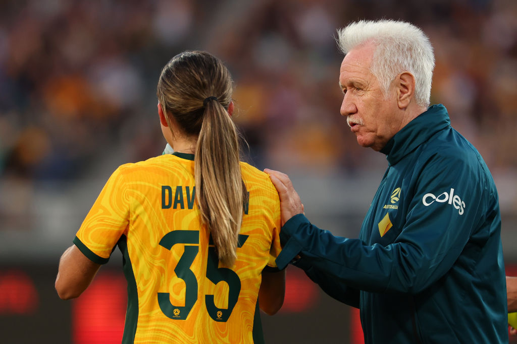 GEELONG, AUSTRALIA - DECEMBER 07: Tom Sermanni interim head coach of Australia speaks to Leah Davidson of Australia during the International Friendly Match between the Australia Matildas and Chinese Taipei at GMHBA Stadium on December 07, 2024 in Geelong, Australia. (Photo by Morgan Hancock/Getty Images)