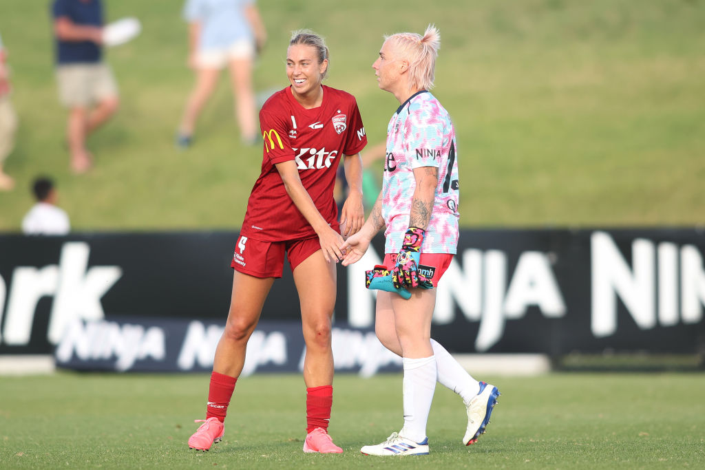 ADELAIDE, AUSTRALIA - DECEMBER 08: Matilda McNamara and Claudia Jenkins of Adelaide United celebrate a win during the round five A-League Women's match between Adelaide United and Newcastle Jets at ServiceFM Stadium, on December 08, 2024, in Adelaide, Australia. (Photo by Maya Thompson/Getty Images)