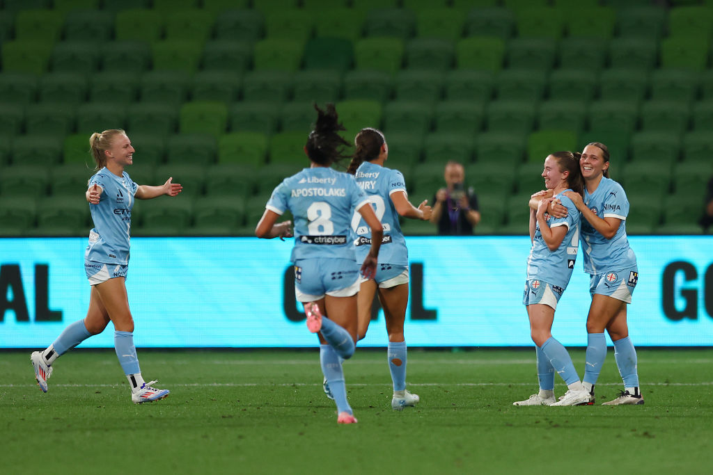 MELBOURNE, AUSTRALIA - DECEMBER 15: Laura Hughes of Melbourne City celebrates a goal with her teammates during the round six A-League Women's match between Melbourne City and Canberra United at AAMI Park on December 15, 2024 in Melbourne, Australia. (Photo by Graham Denholm/Getty Images)