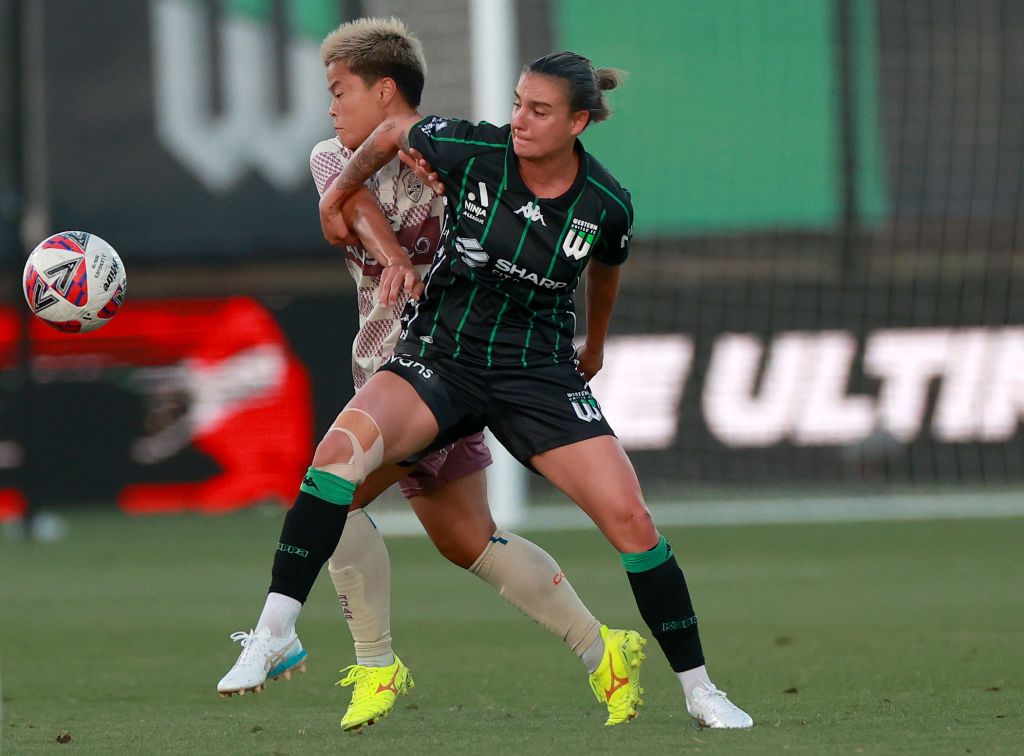 MELBOURNE, AUSTRALIA - DECEMBER 29: Momo Hayashi of the Roar and Chloe Logarzo of Western United compete for the ball during the round eight A-League Women's match between Western United and Brisbane Roar at Ironbark Fields, on December 29, 2024, in Melbourne, Australia. (Photo by Kelly Defina/Getty Images)