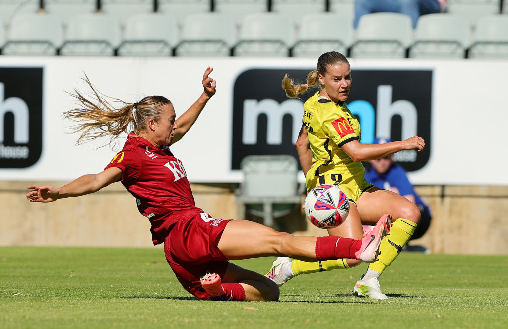 ADELAIDE, AUSTRALIA - JANUARY 12: Matilda McNamara of Adelaide United and Olivia Fergusson of Wellington Phoenix during the round 11 A-League Women's match between Adelaide United and Wellington Phoenix at Marden Sports Complex, on January 12, 2025, in Adelaide, Australia. (Photo by Sarah Reed/Getty Images)