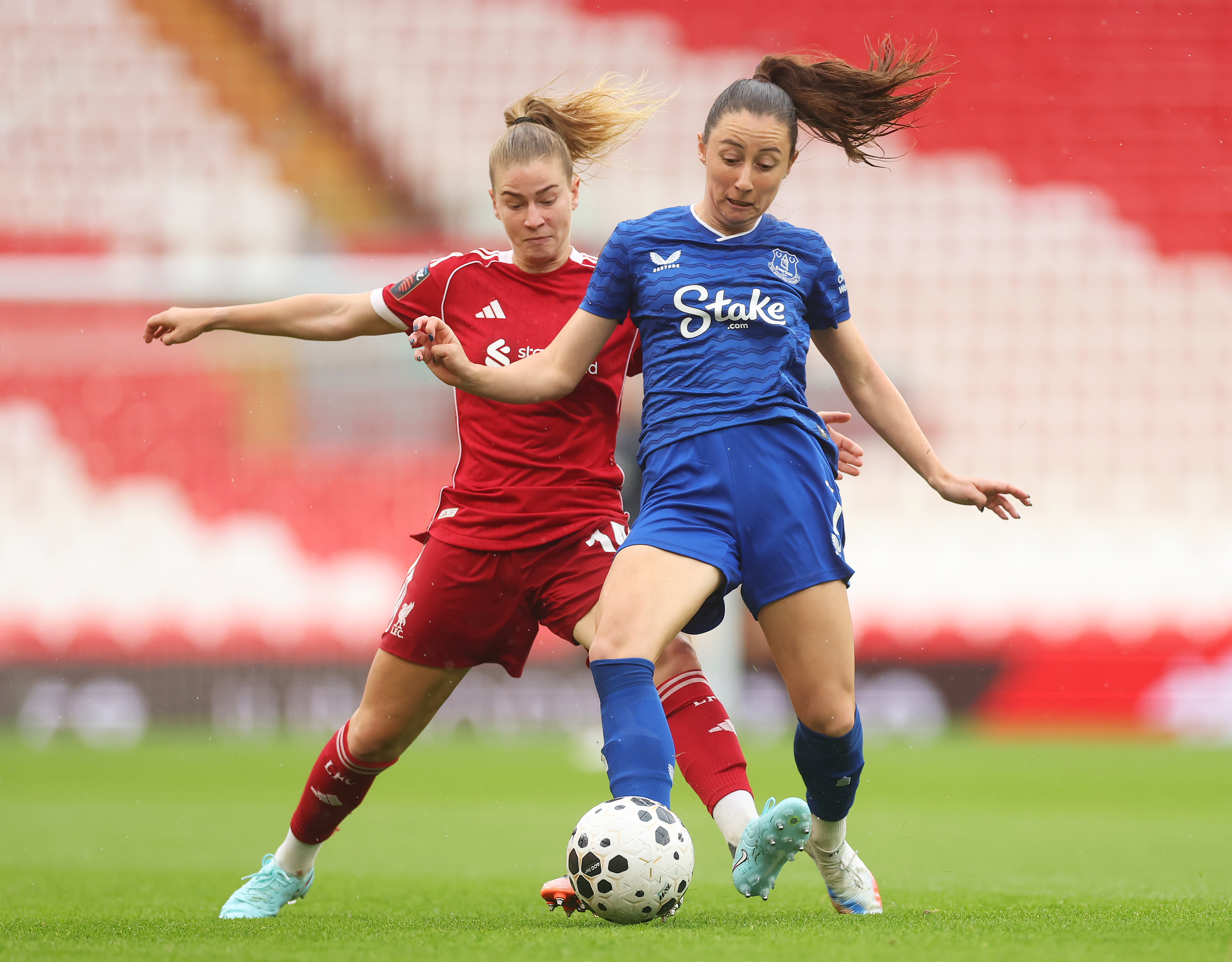 Clare Wheeler of Everton is challenged by Marie-Therese Hoebinger of Liverpool during the Barclays Women's Super League match between Liverpool and Everton at Anfield on September 07, 2025 in Liverpool, England. (Photo by Carl Recine/Getty Images)